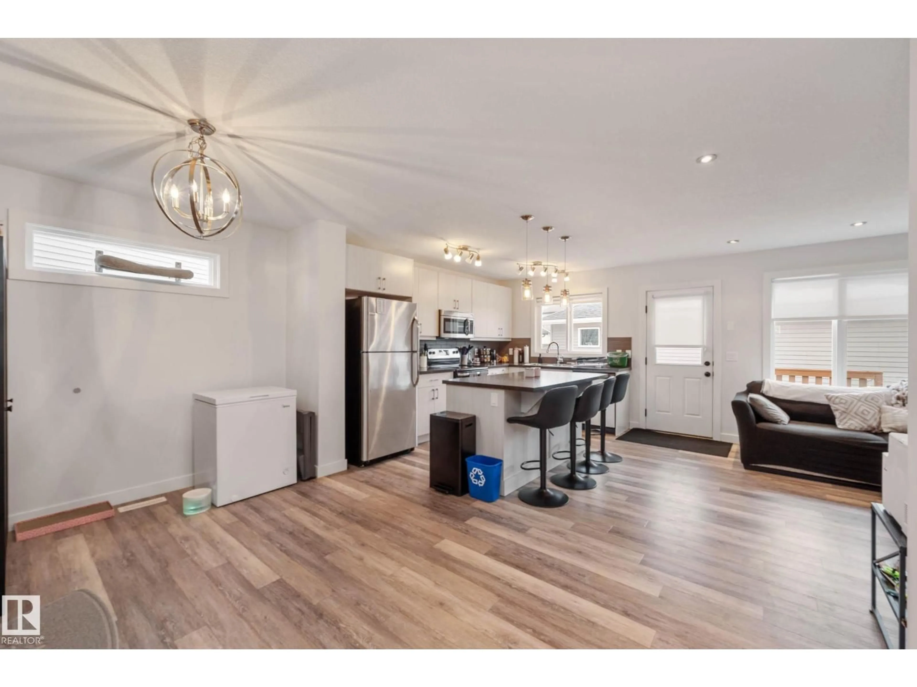 Open concept kitchen, wood/laminate floor for SW - 7204 CARDINAL WY, Edmonton Alberta T6W2Y5