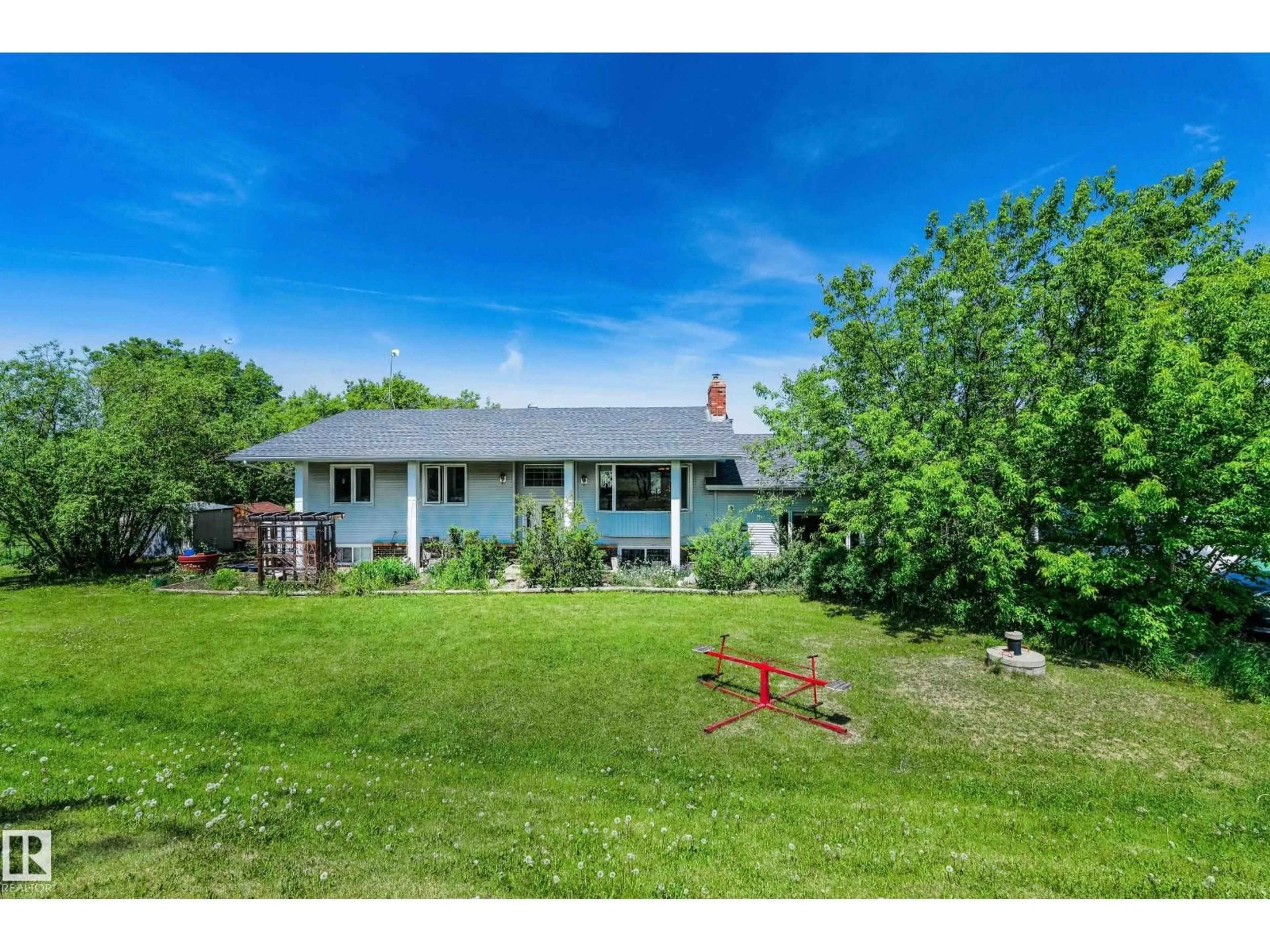 A pic from outside/outdoor area/front of a property/back of a property/a pic from drone, unknown for 145 22458 TWP ROAD 510, Rural Strathcona County Alberta T8C1H1