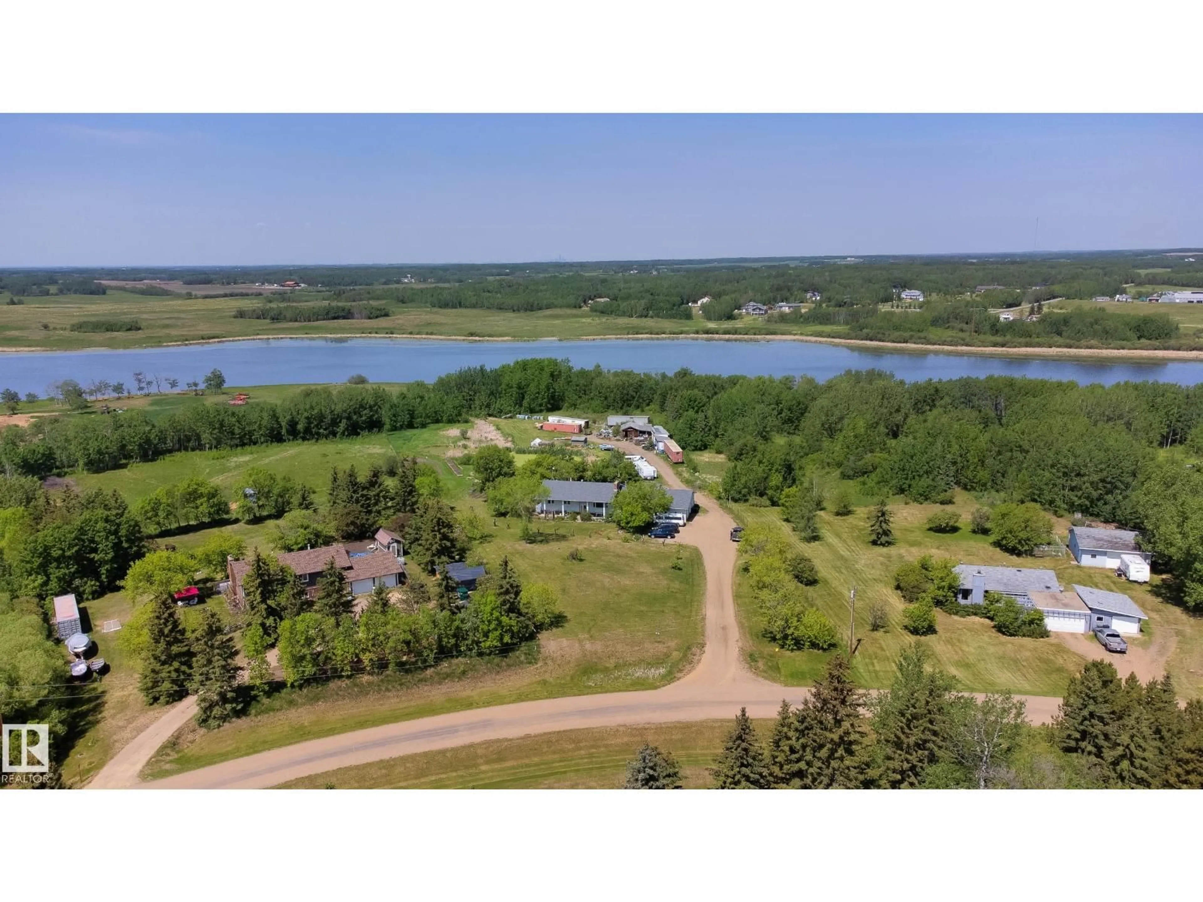 A pic from outside/outdoor area/front of a property/back of a property/a pic from drone, water/lake/river/ocean view for 145 22458 TWP ROAD 510, Rural Strathcona County Alberta T8C1H1