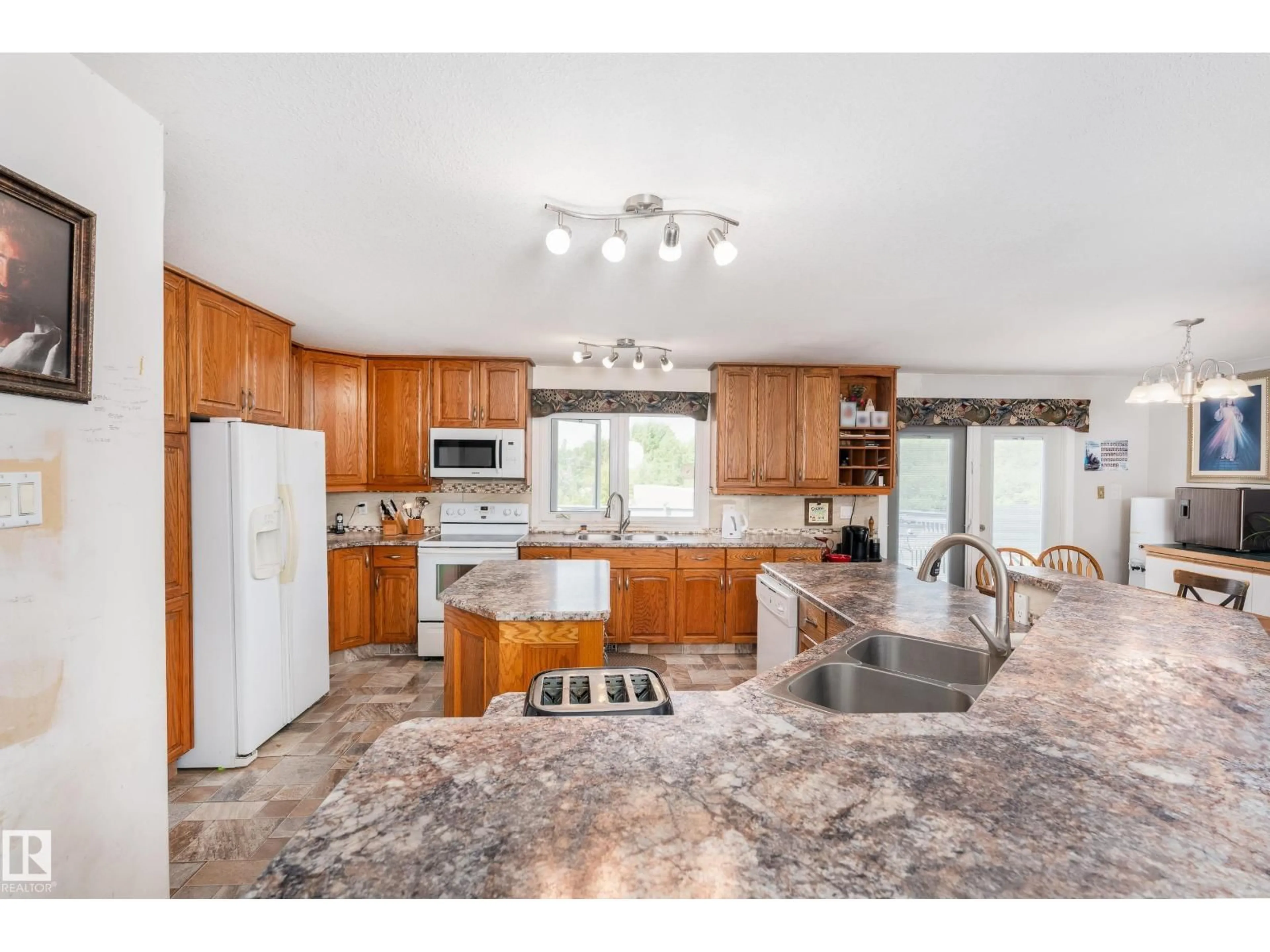 Open concept kitchen, ceramic/tile floor for 145 22458 TWP ROAD 510, Rural Strathcona County Alberta T8C1H1
