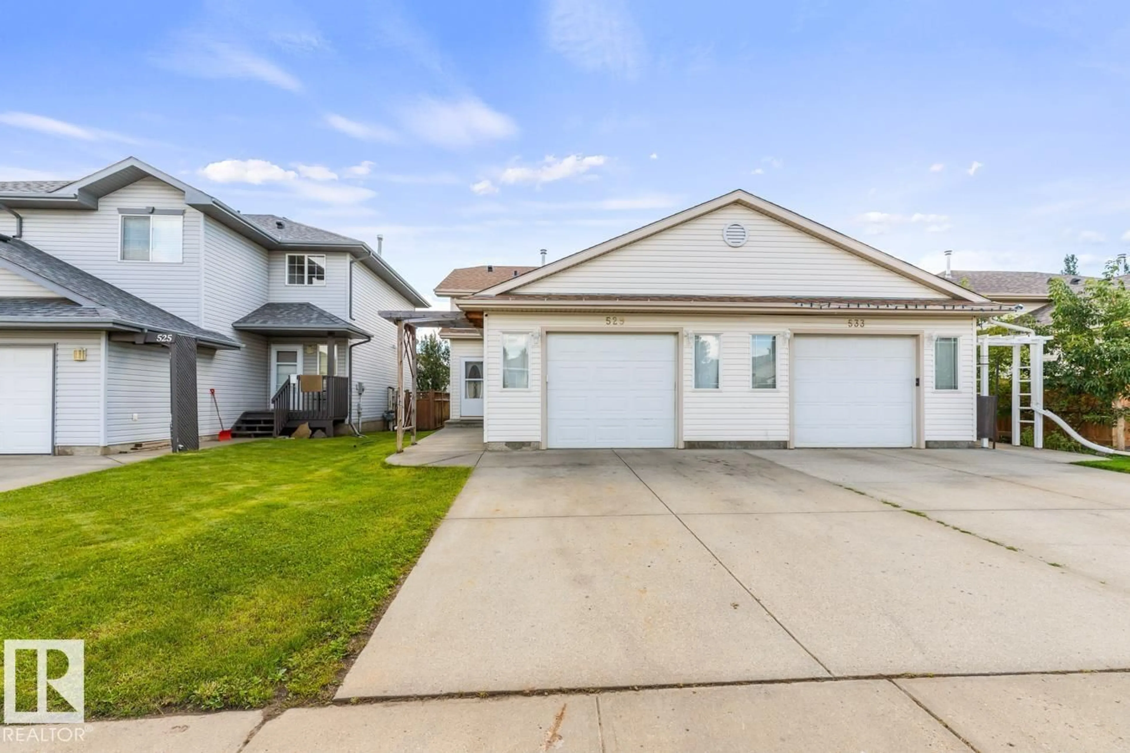 Home with vinyl exterior material, street for 529 KANANASKIS DR, Devon Alberta T9G2C8