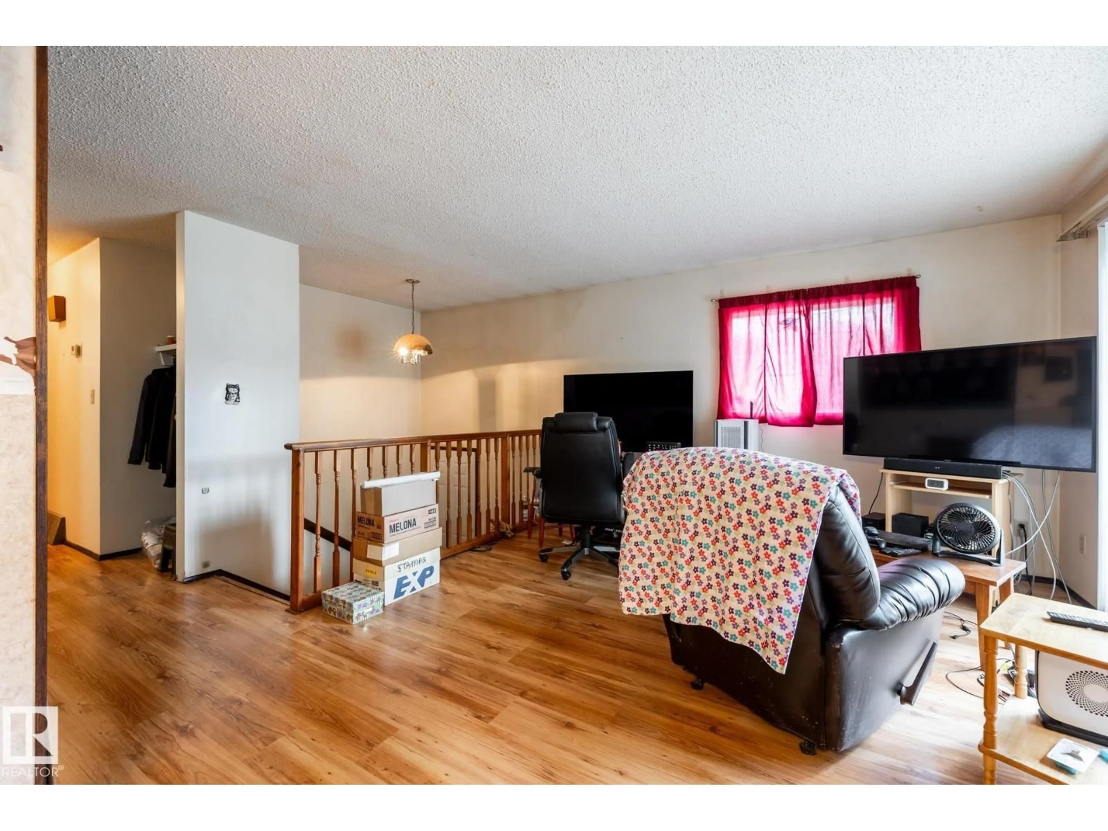 Living room with furniture, wood/laminate floor for NW - 10254 148 ST, Edmonton Alberta T5N3G4