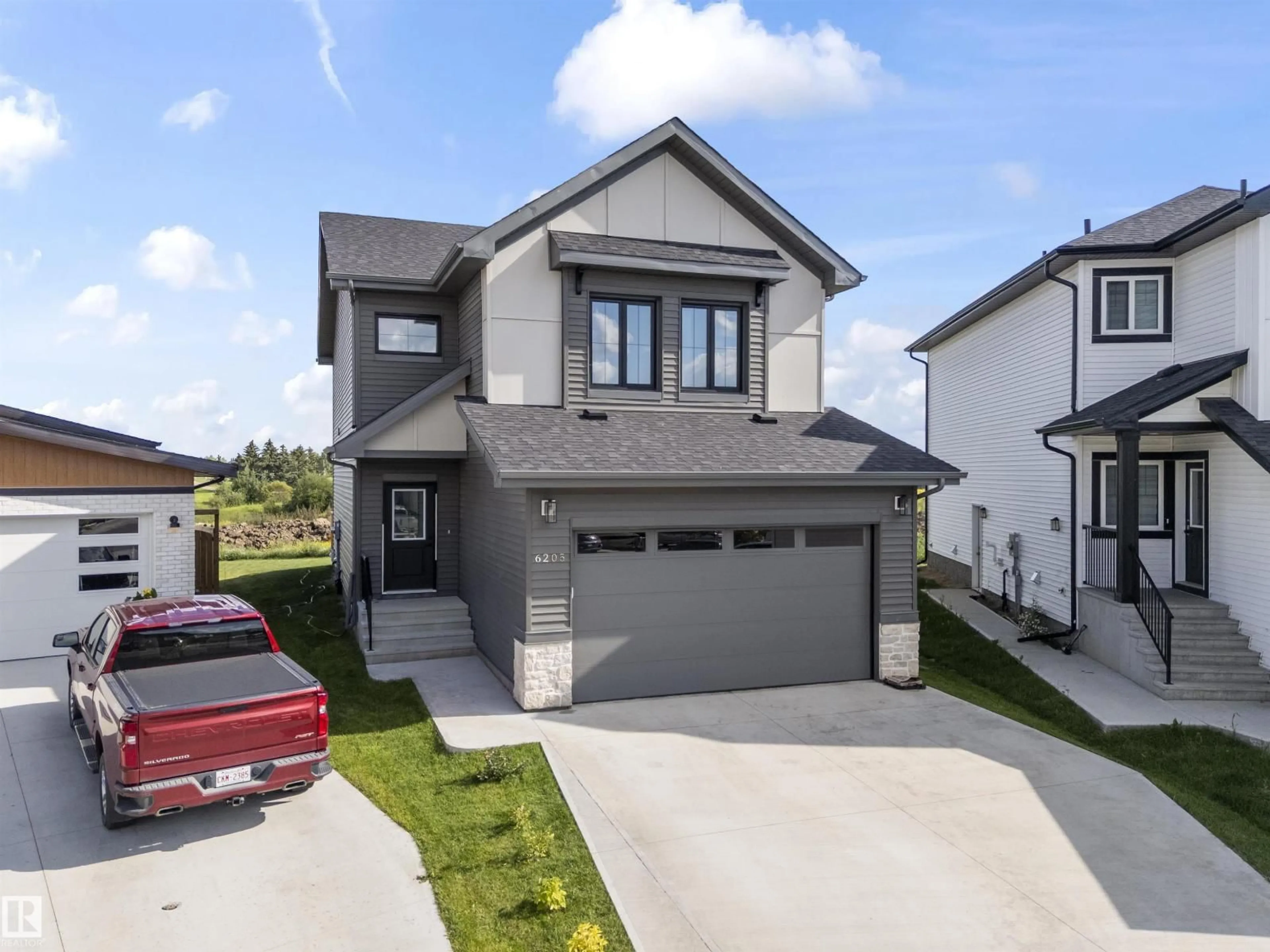 Home with vinyl exterior material, street for 6205 46 AV, Beaumont Alberta T4X2Z2