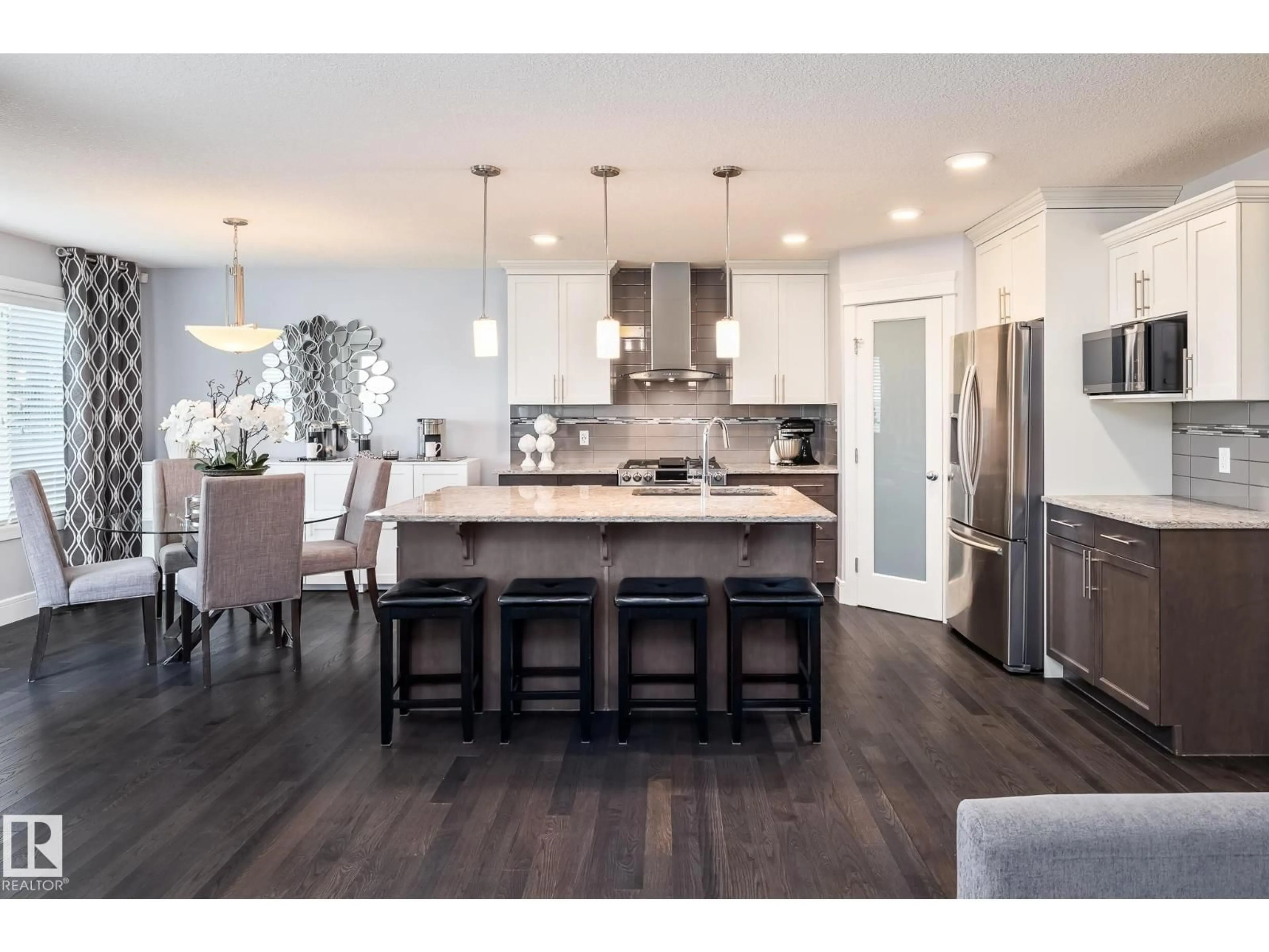 Open concept kitchen, wood/laminate floor for SW - 7132 ARMOUR LINK LI, Edmonton Alberta T6W2P1