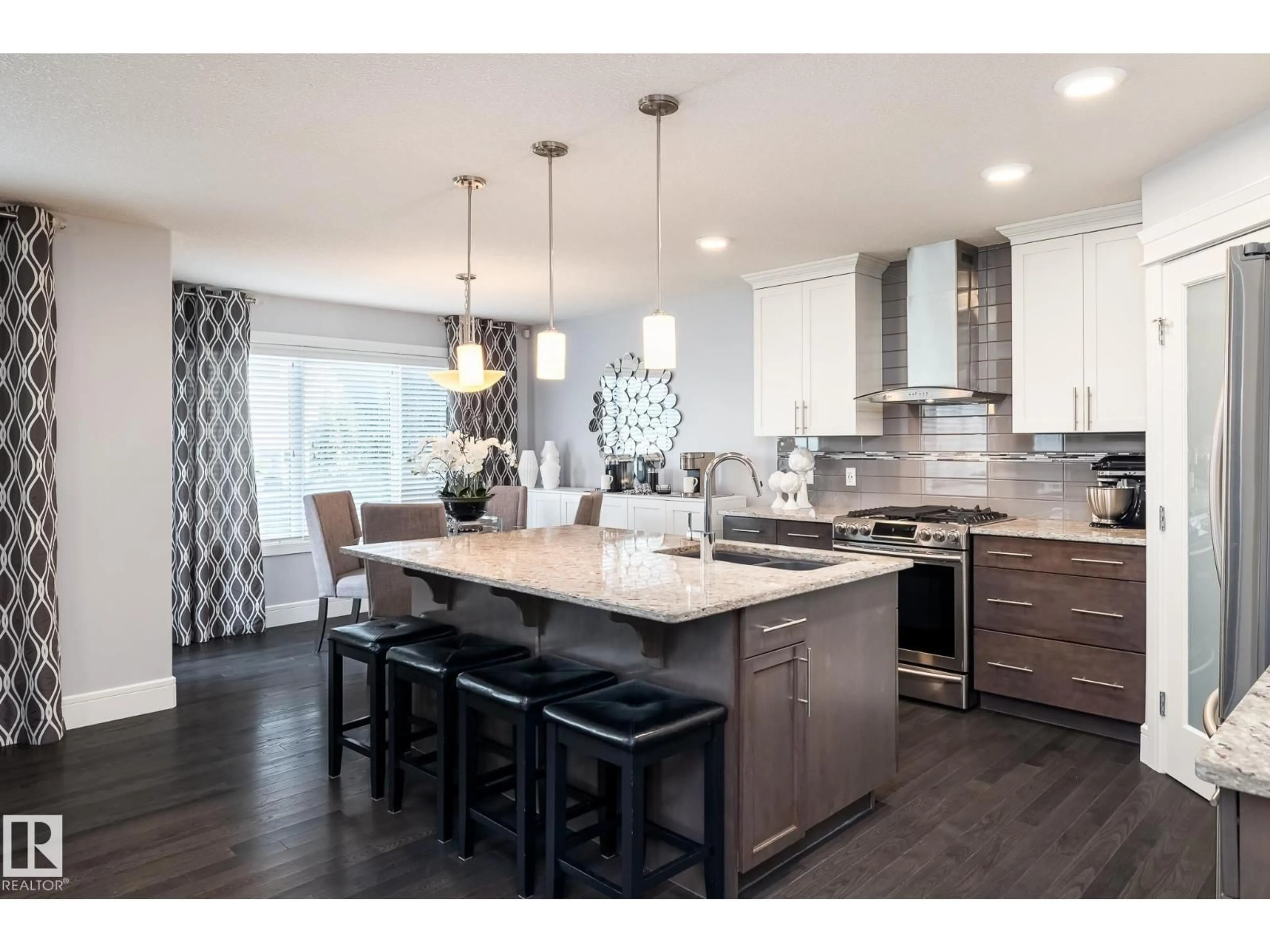 Open concept kitchen, wood/laminate floor for SW - 7132 ARMOUR LINK LI, Edmonton Alberta T6W2P1