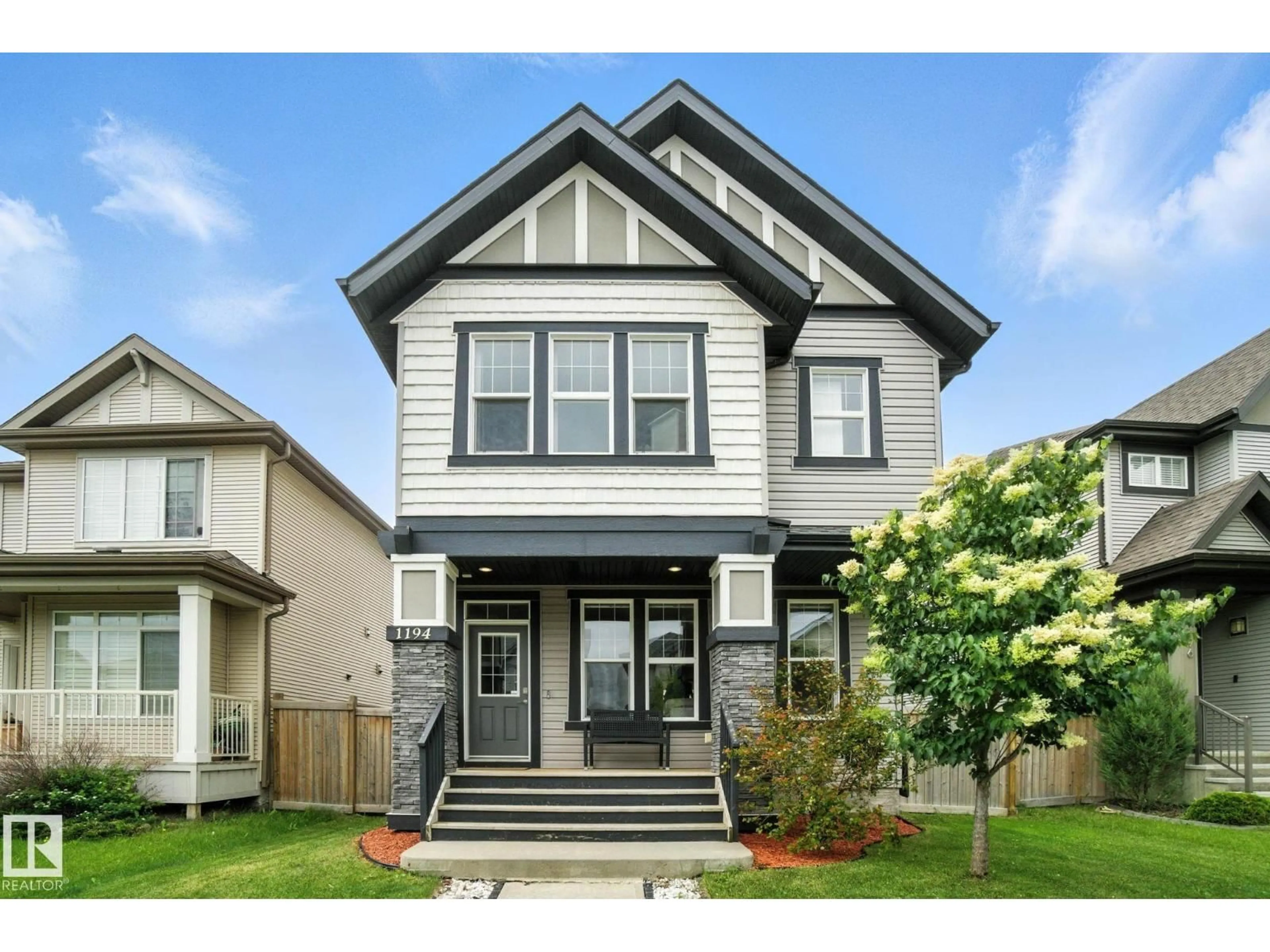 Home with vinyl exterior material, street for 1194 MCCONACHIE BV, Edmonton Alberta T5Y0V1