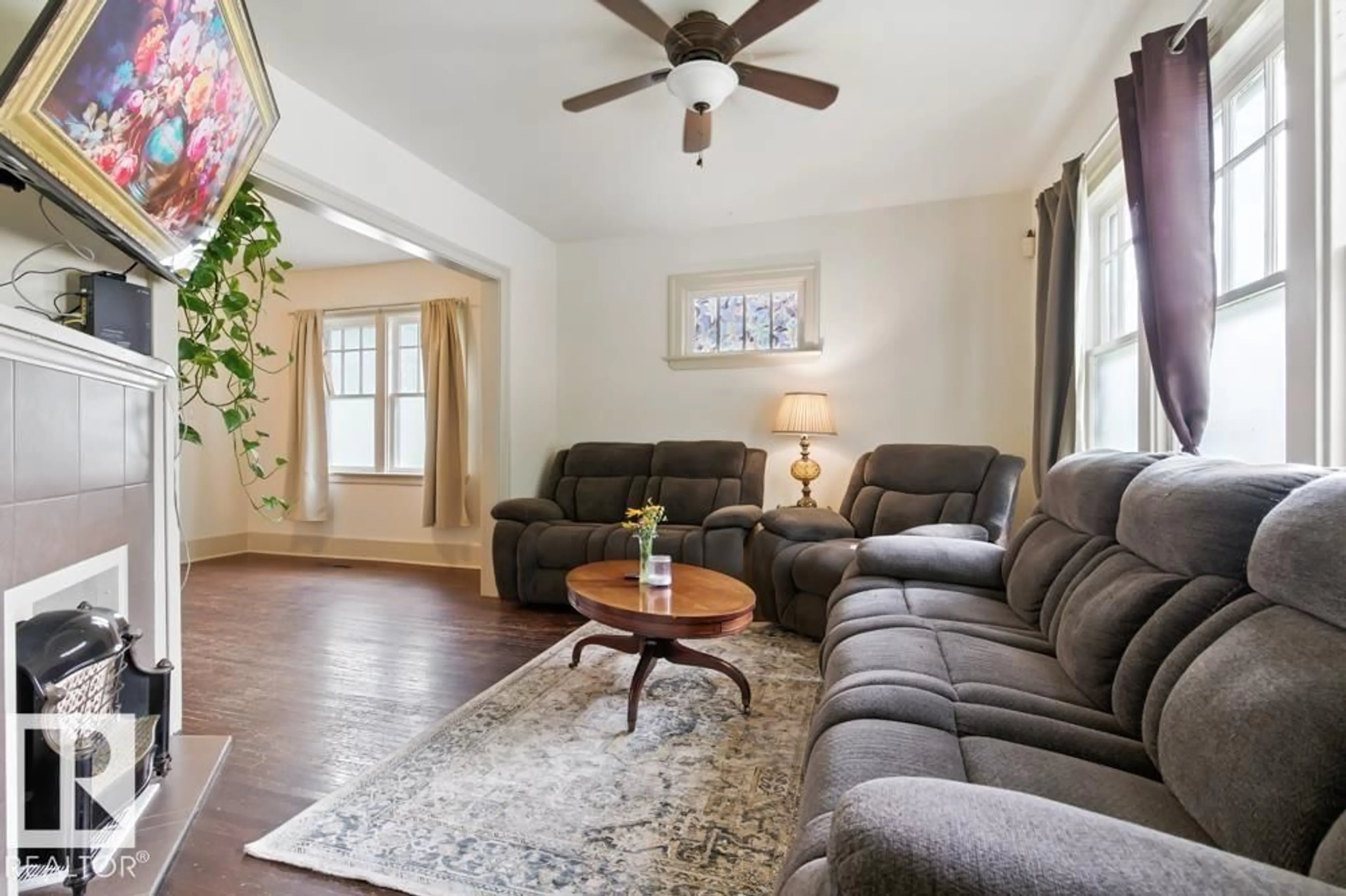 Living room with furniture, unknown for 10428 76 AV, Edmonton Alberta T6E1L1