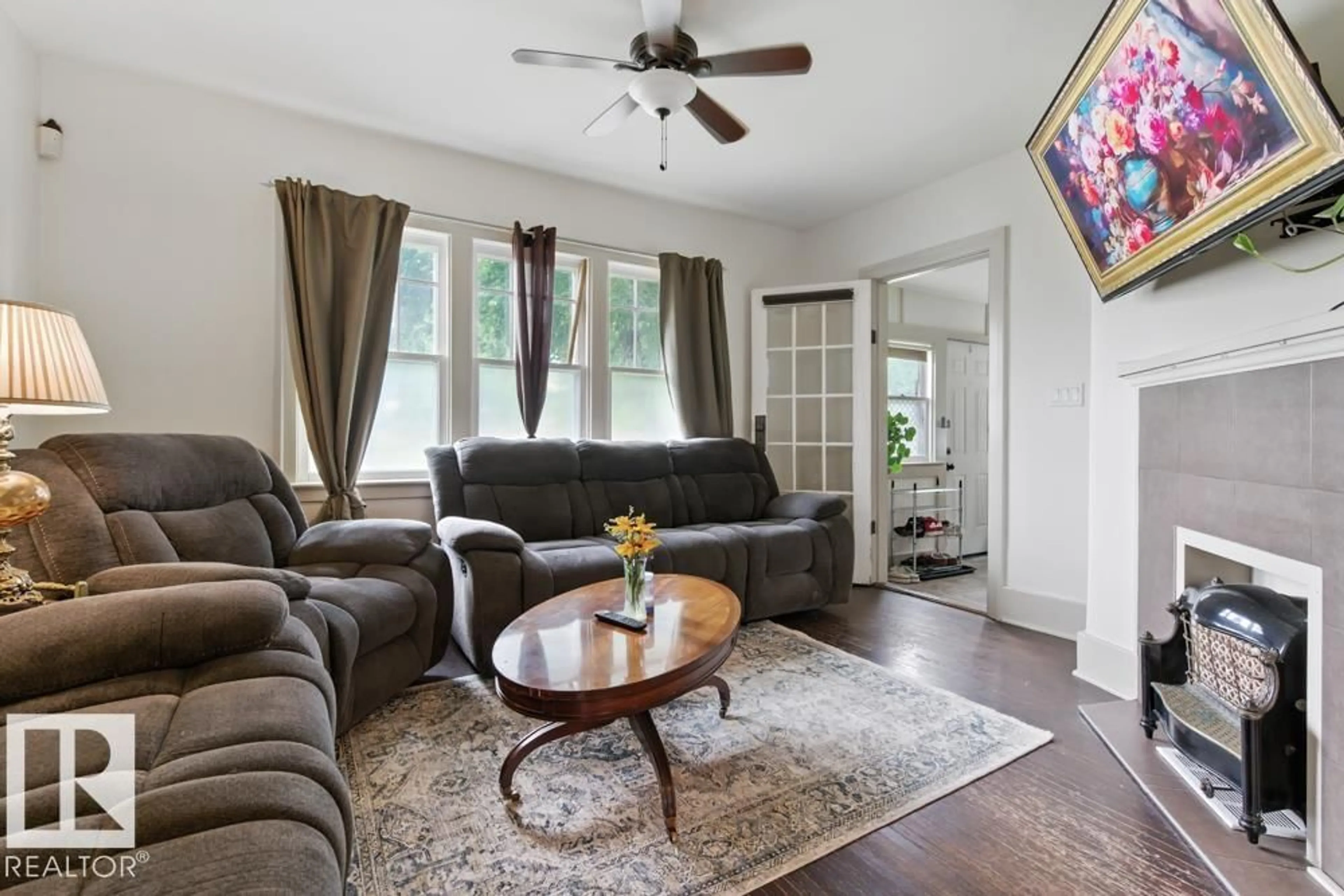 Living room with furniture, unknown for 10428 76 AV, Edmonton Alberta T6E1L1
