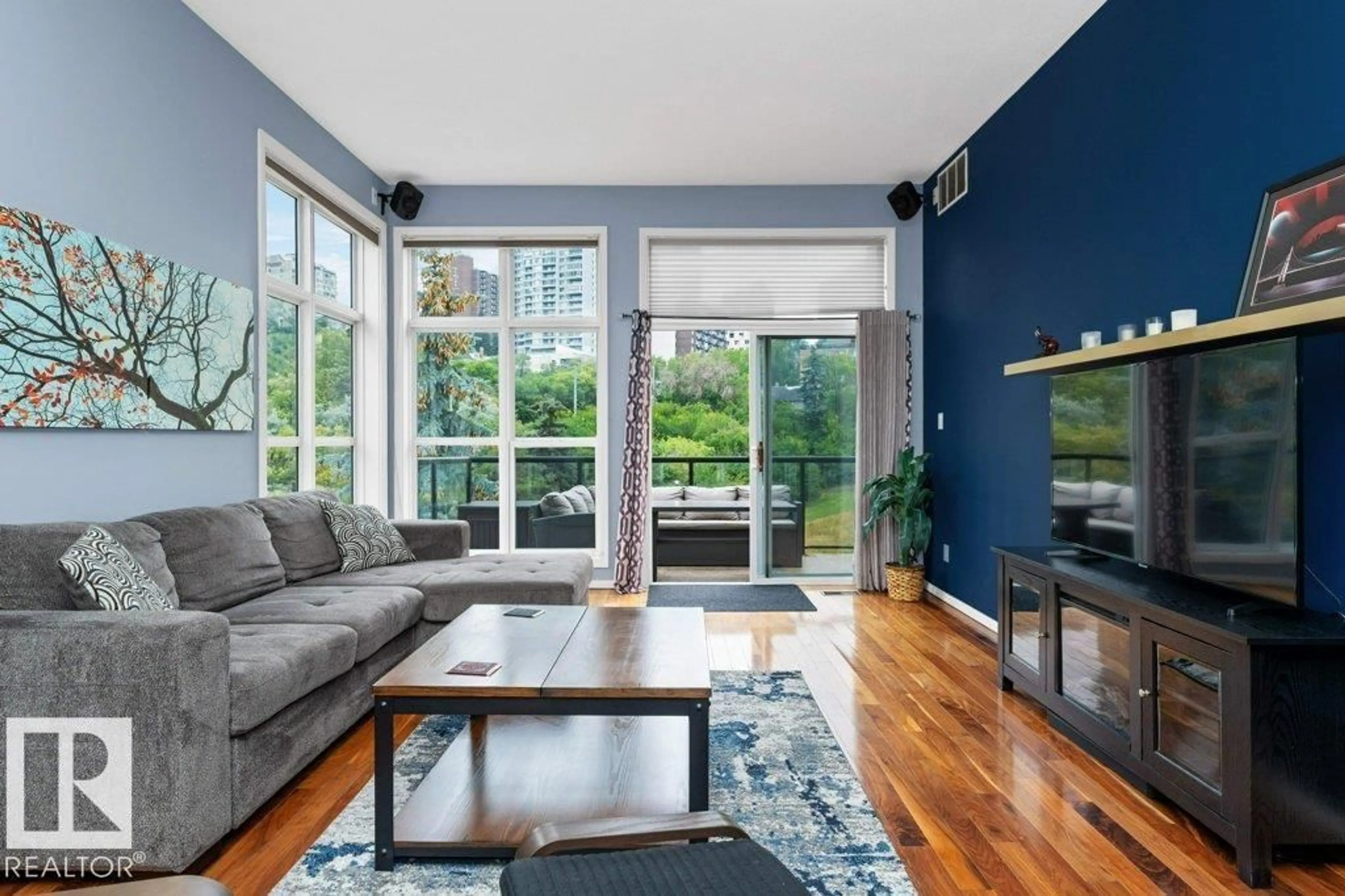 Living room with furniture, wood/laminate floor for #418 - 9804 101 ST, Edmonton Alberta T5K2X3