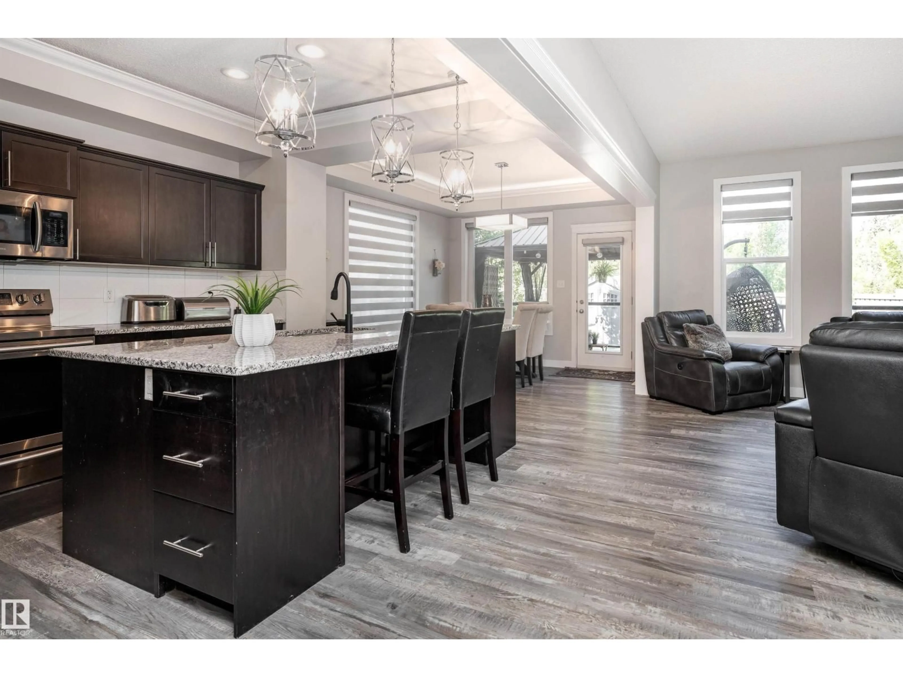 Open concept kitchen, wood/laminate floor for 5533 EDWORTHY WY, Edmonton Alberta T6M0N8