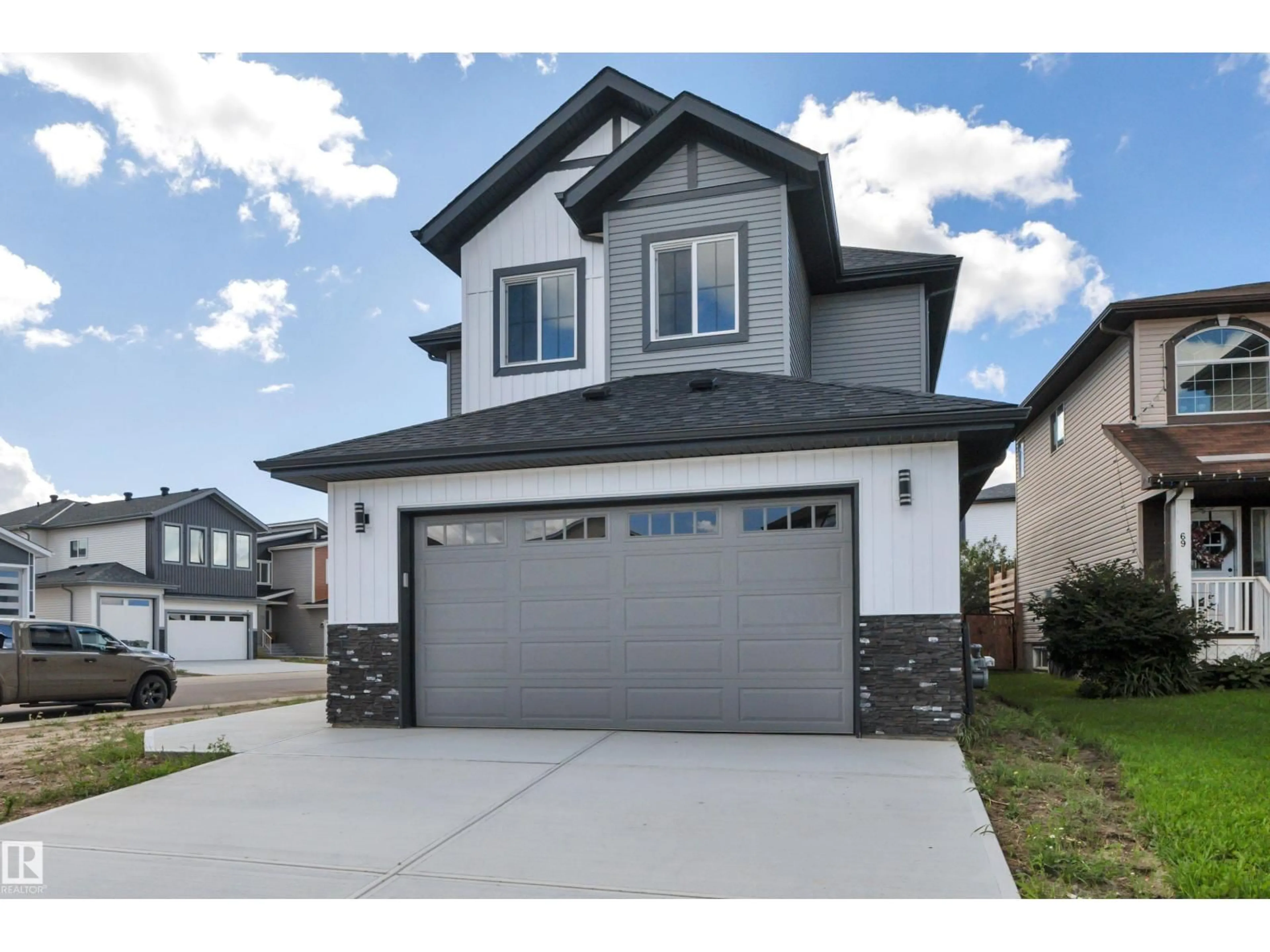 Home with vinyl exterior material, street for 67 DALQUIST BA, Leduc Alberta T9E1N7