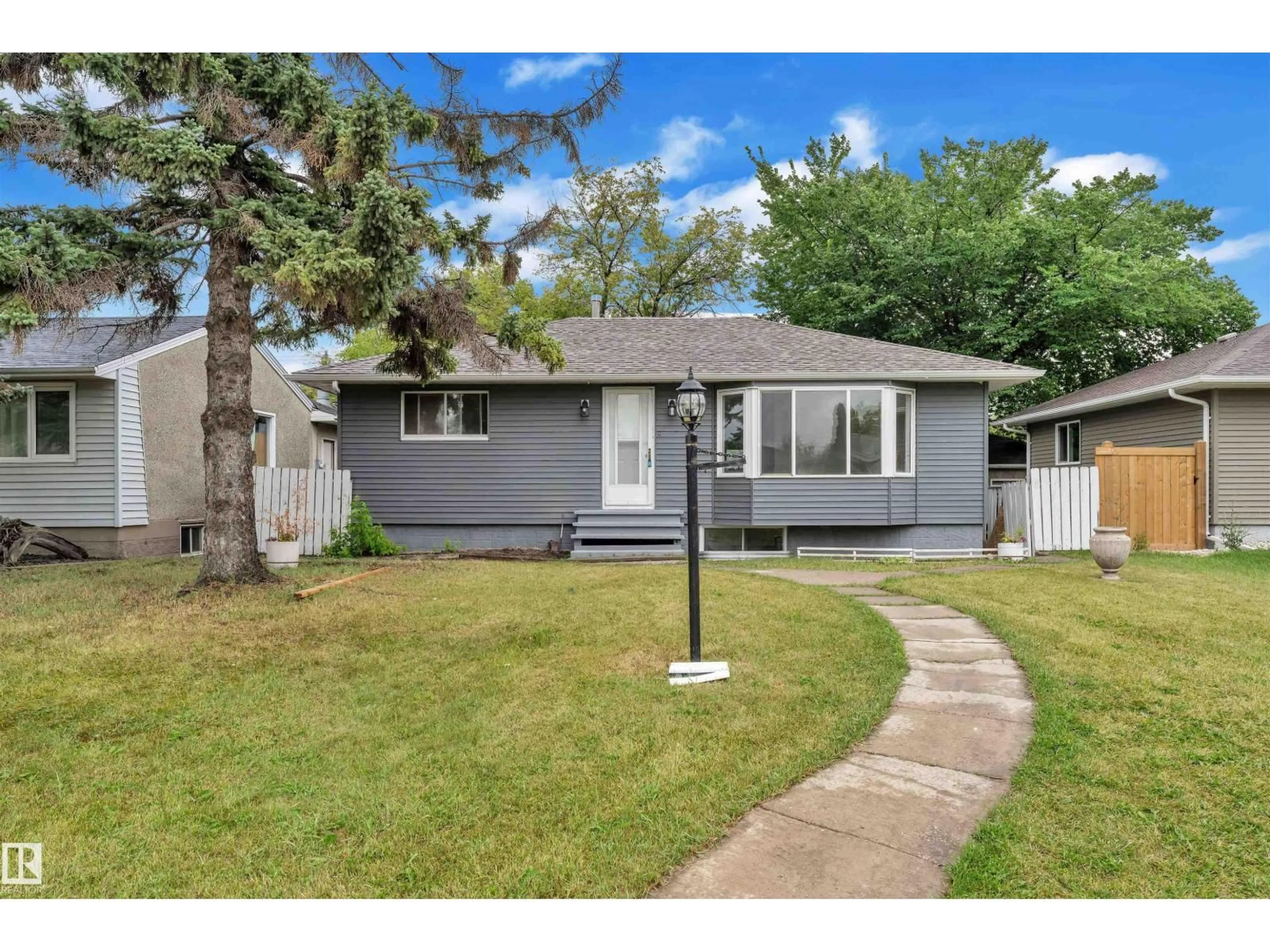 Home with vinyl exterior material, street for 15965 110B AV, Edmonton Alberta T5P1J5