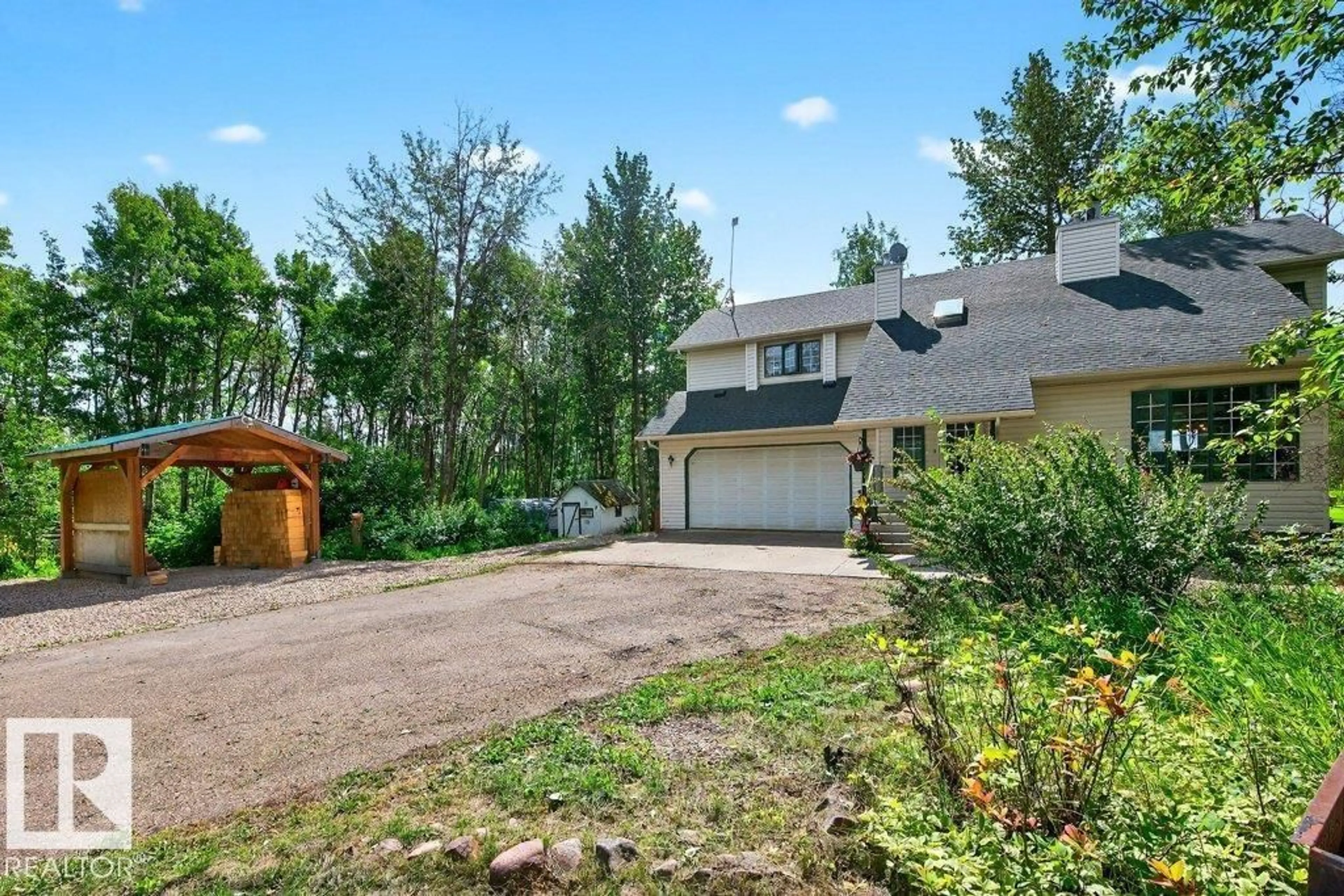 A pic from outside/outdoor area/front of a property/back of a property/a pic from drone, mountain view for 50470 - 150 RGE ROAD 234, Rural Leduc County Alberta T4X0L7