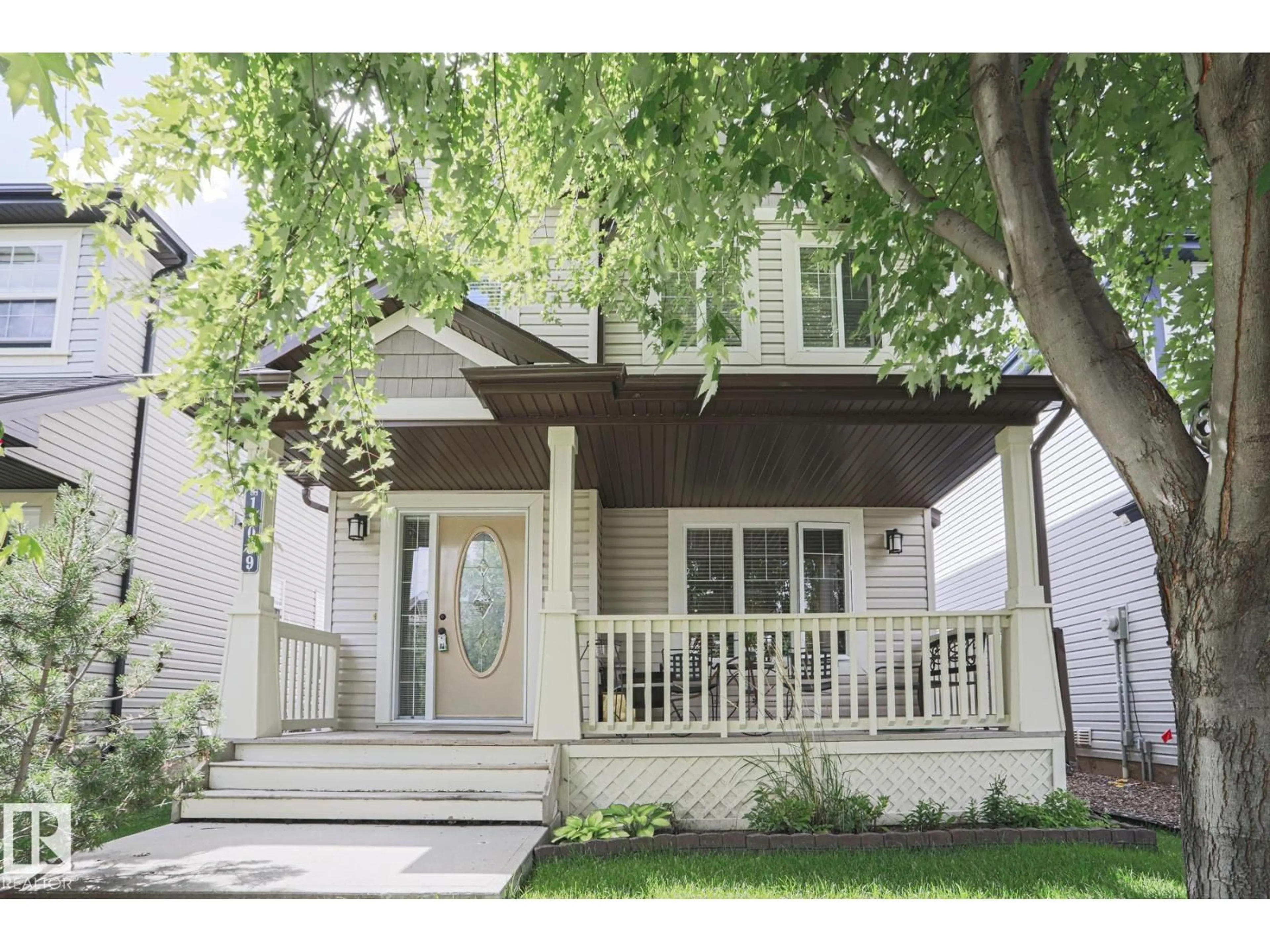 Home with vinyl exterior material, street for 12039 18 AV, Edmonton Alberta T6W1W3