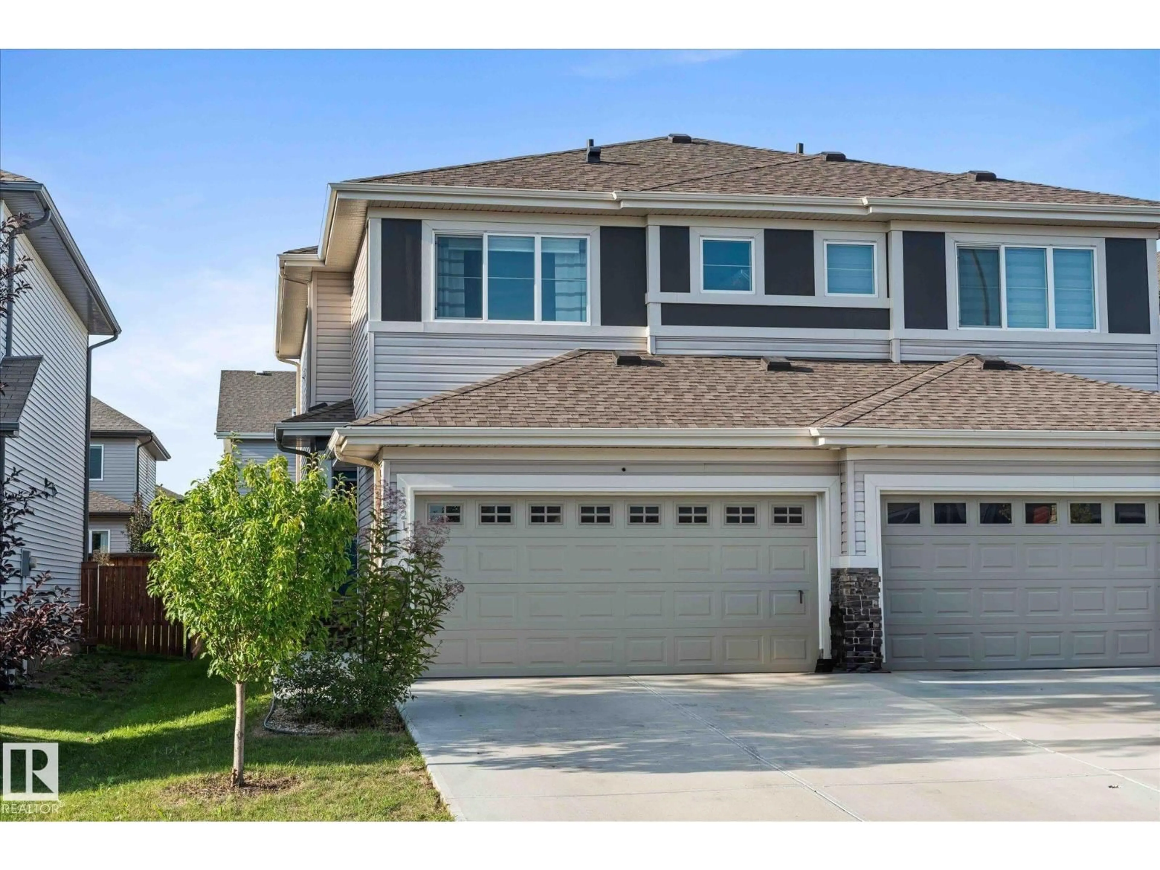 Home with vinyl exterior material, street for 1321 SOUTH CREEK LI, Stony Plain Alberta T7Z0K6