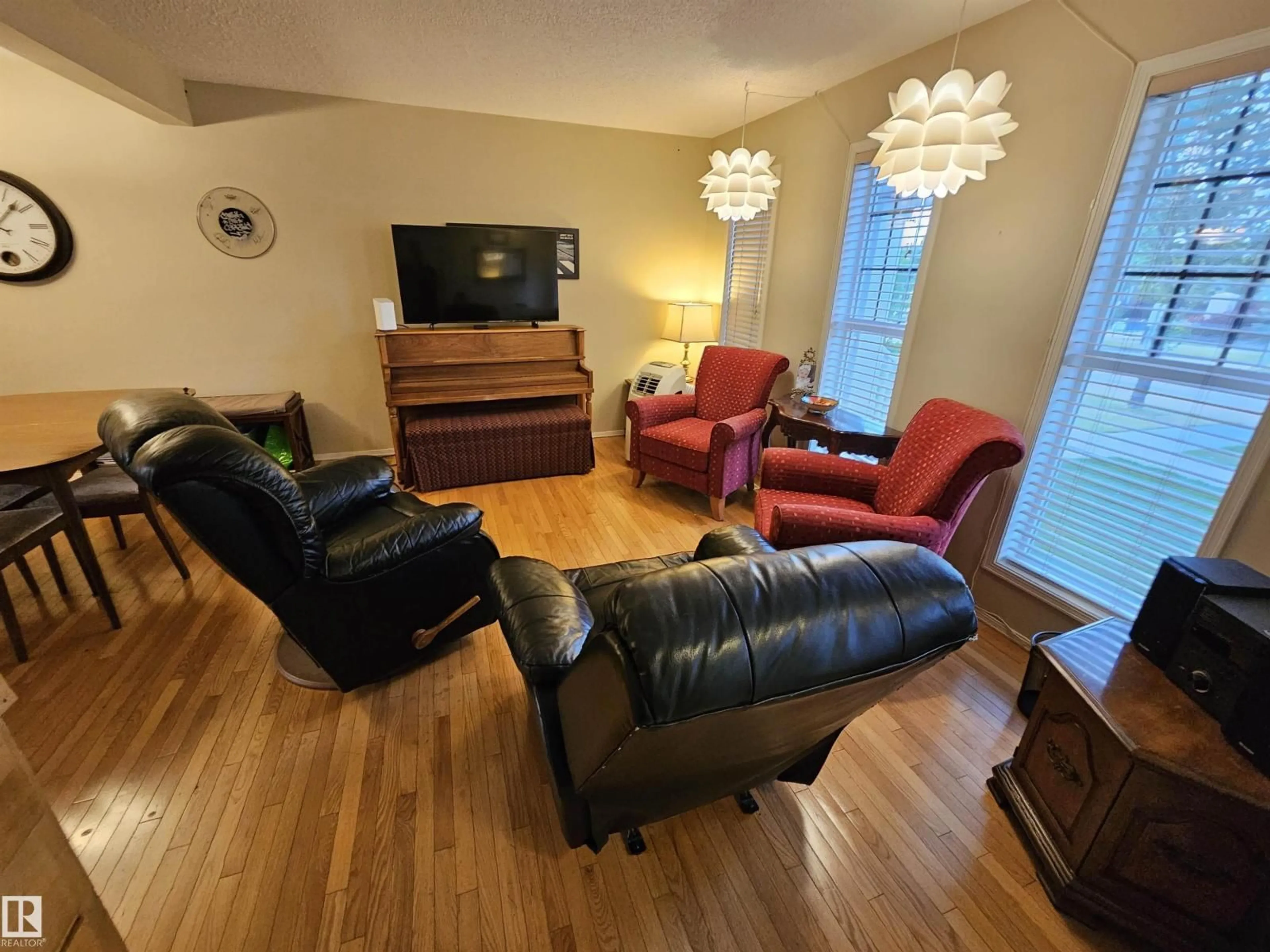 Living room with furniture, wood/laminate floor for 2333 ASPEN TR, Sherwood Park Alberta T8H0G3