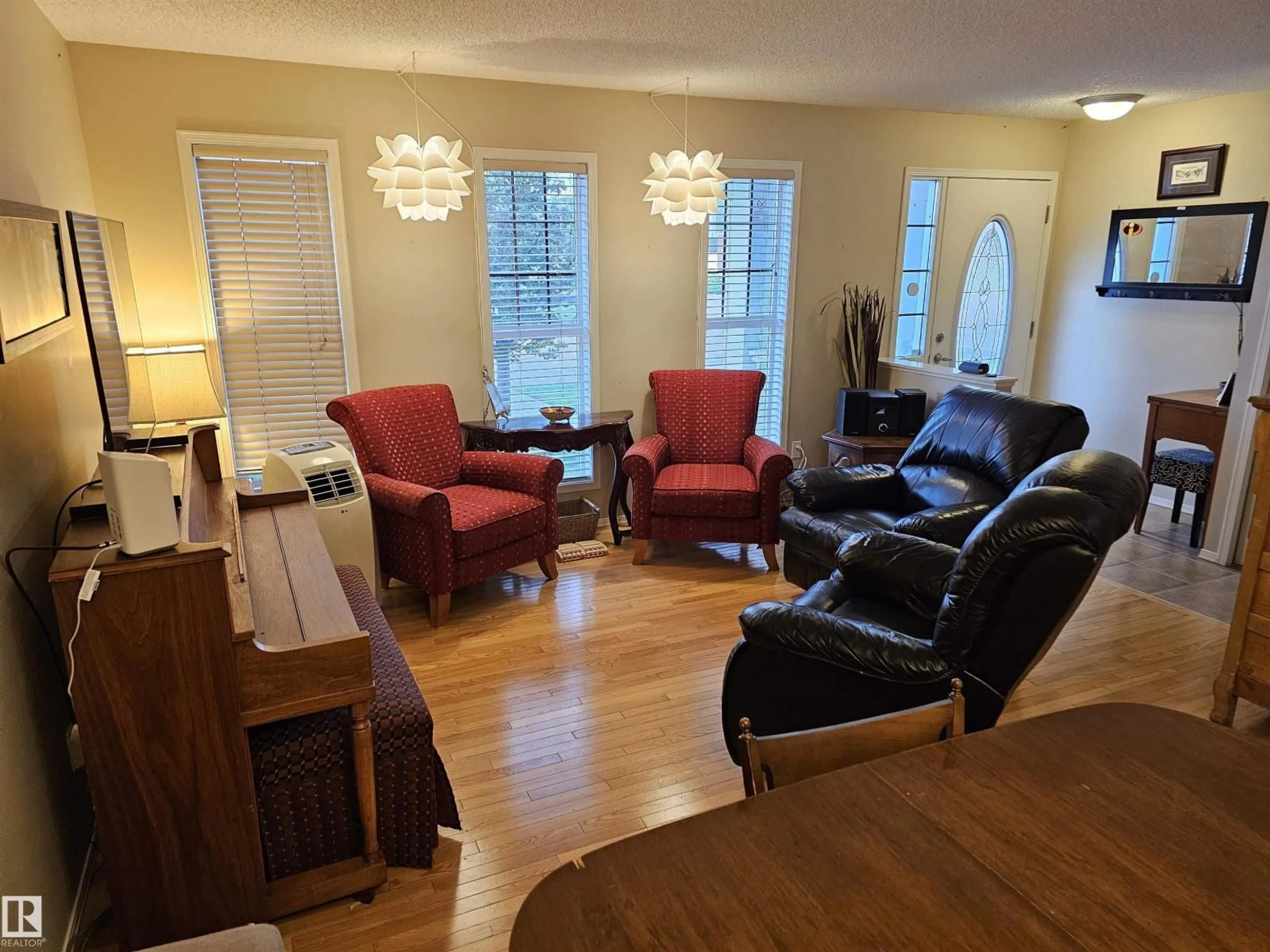 Living room with furniture, wood/laminate floor for 2333 ASPEN TR, Sherwood Park Alberta T8H0G3