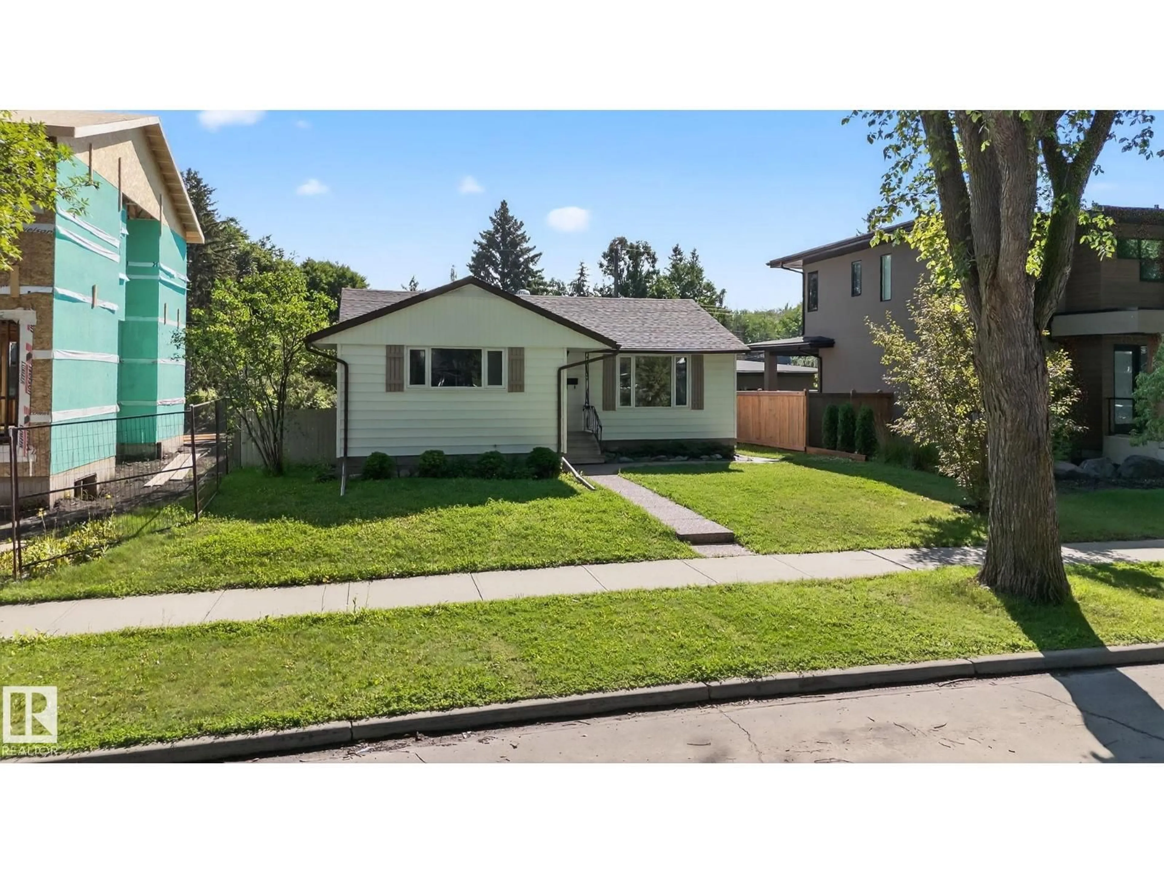Home with vinyl exterior material, street for 9239 148 ST, Edmonton Alberta T5R1A4