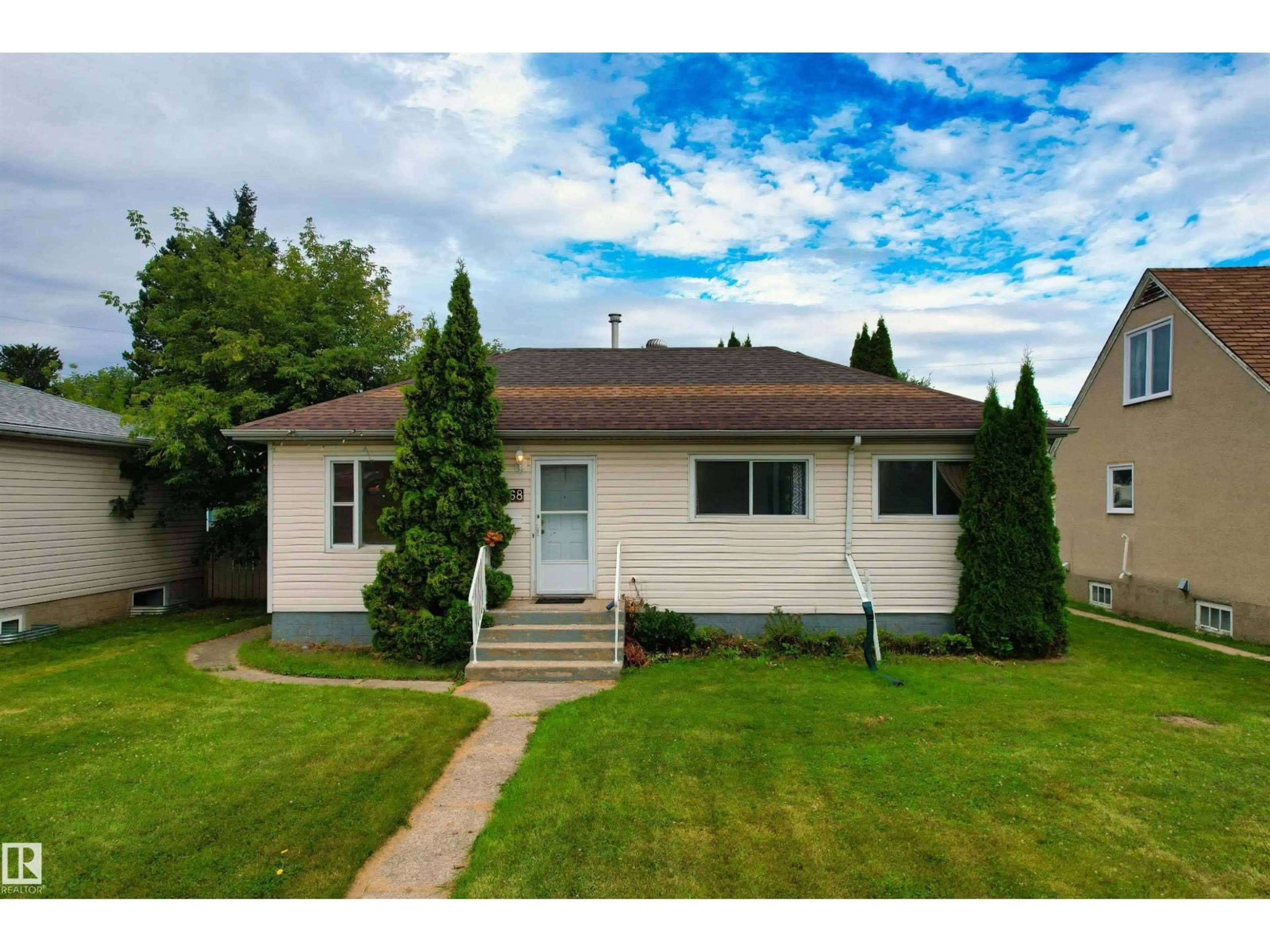 Home with vinyl exterior material, street for NW - 9268 85 ST, Edmonton Alberta T6C3C7