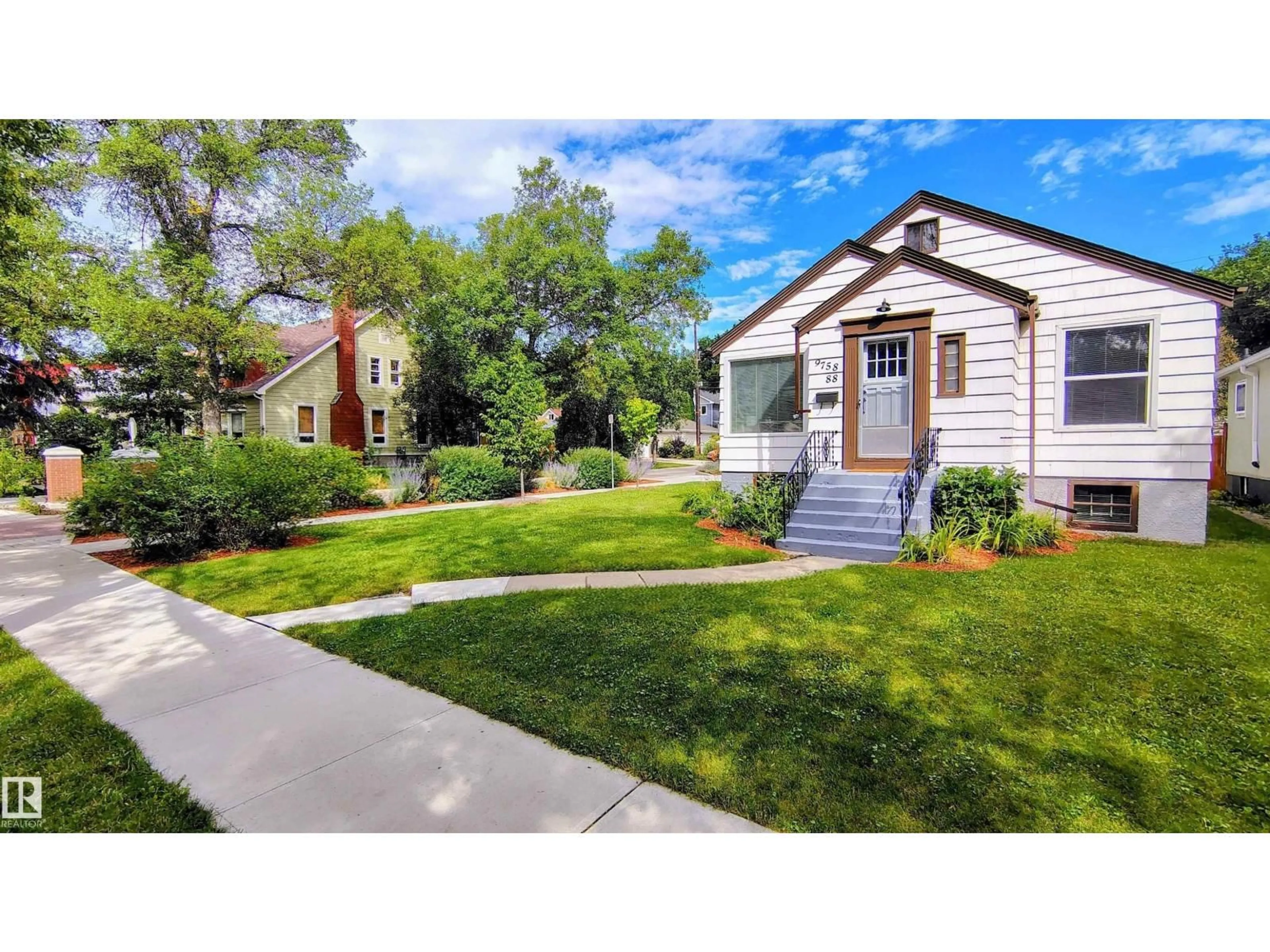 Home with vinyl exterior material, street for NW - 9758 88 AV, Edmonton Alberta T6E2P9