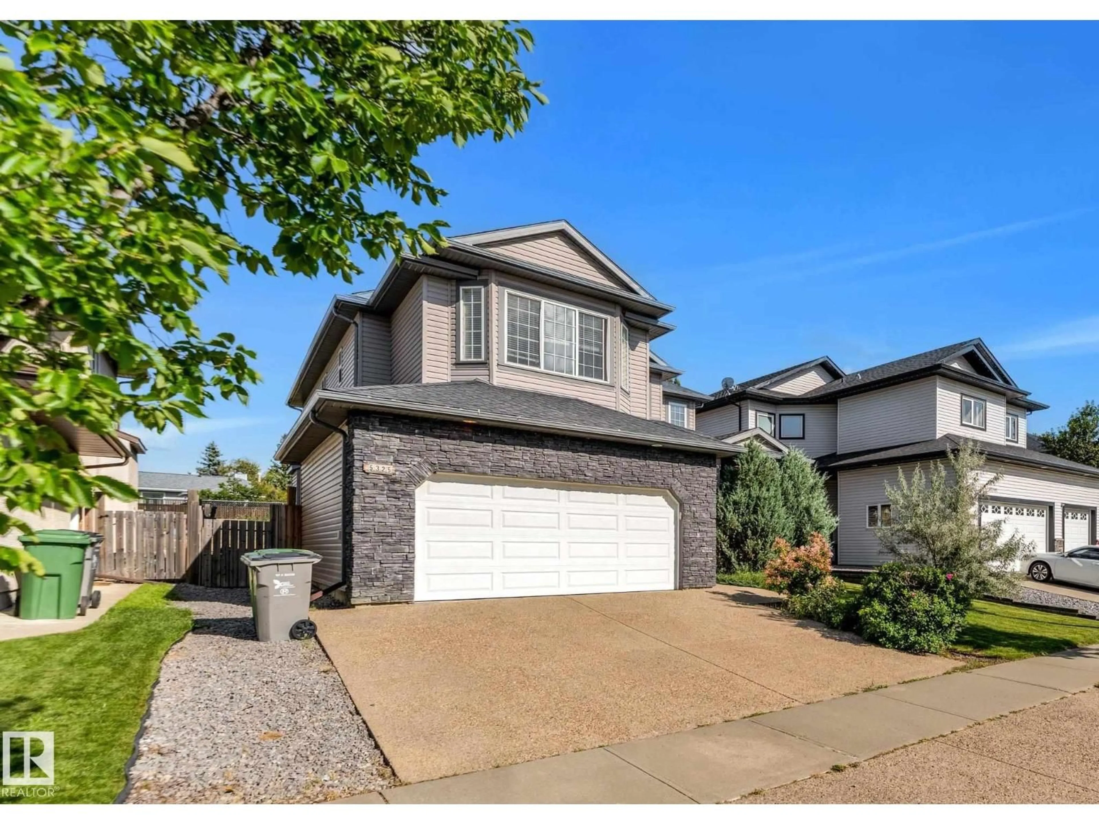 Home with vinyl exterior material, street for 5325 60 ST, Beaumont Alberta T4X0B2