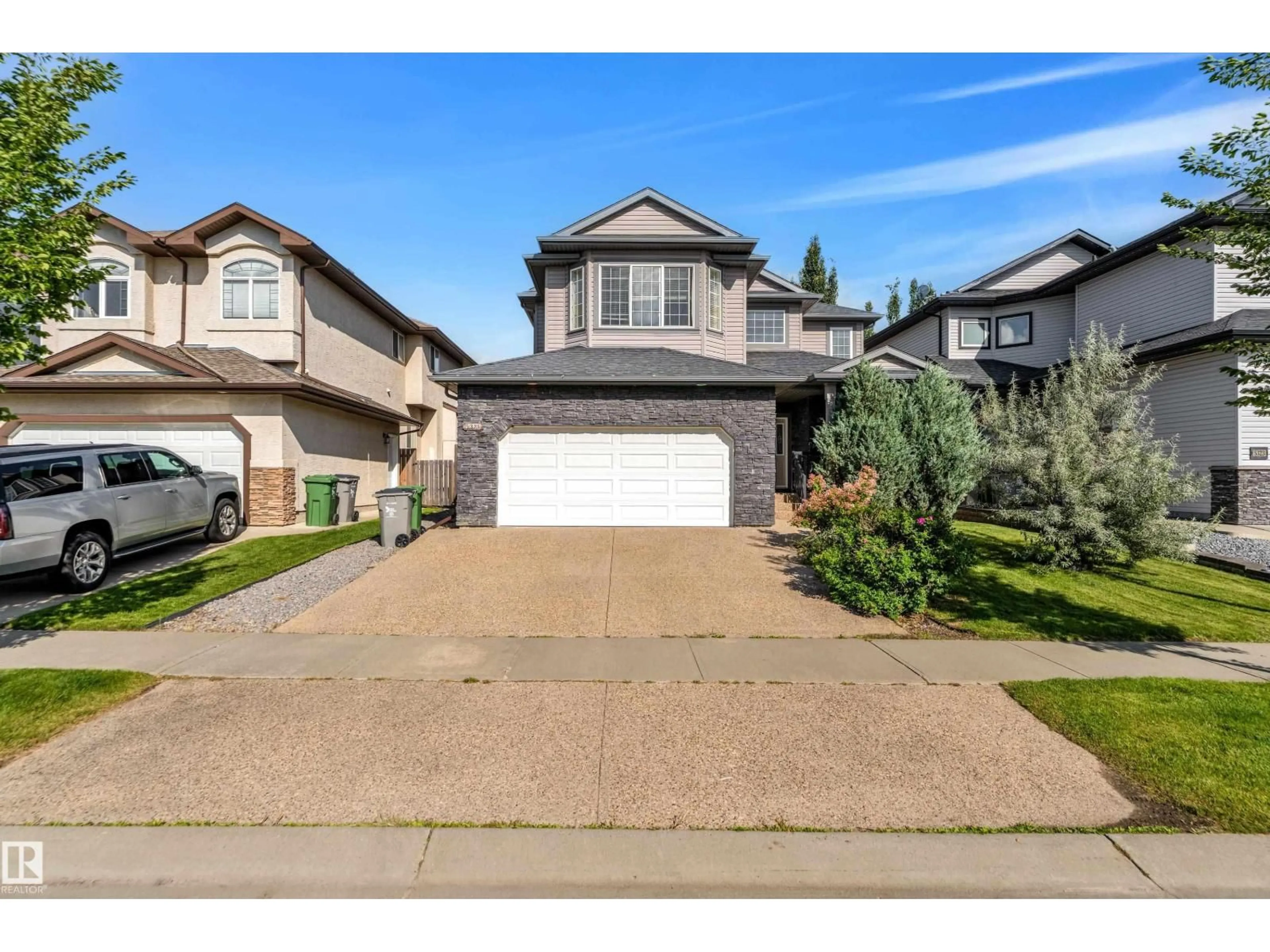 Home with vinyl exterior material, street for 5325 60 ST, Beaumont Alberta T4X0B2