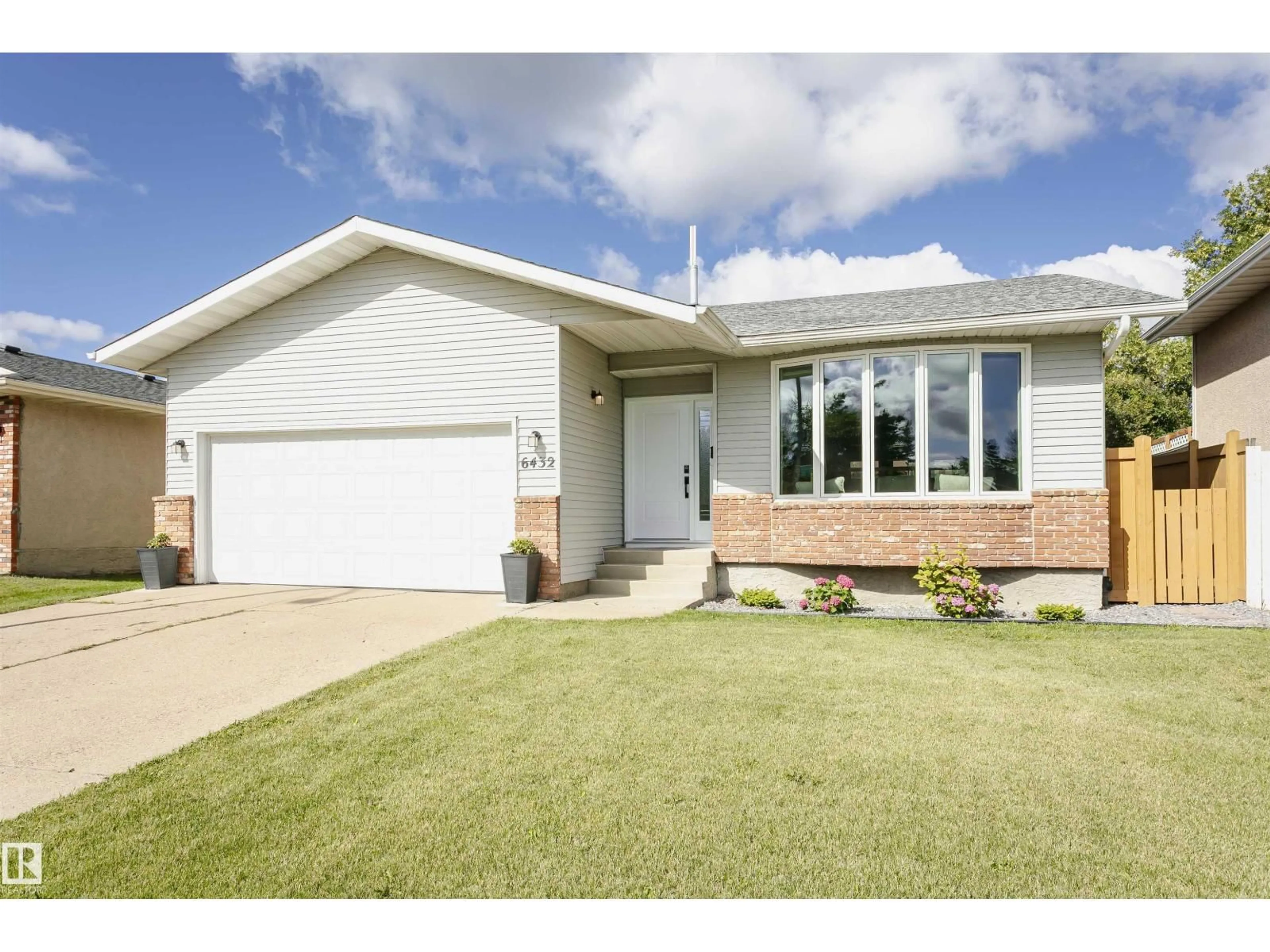 Home with vinyl exterior material, street for NW - 6432 187 ST E, Edmonton Alberta T5T2N3