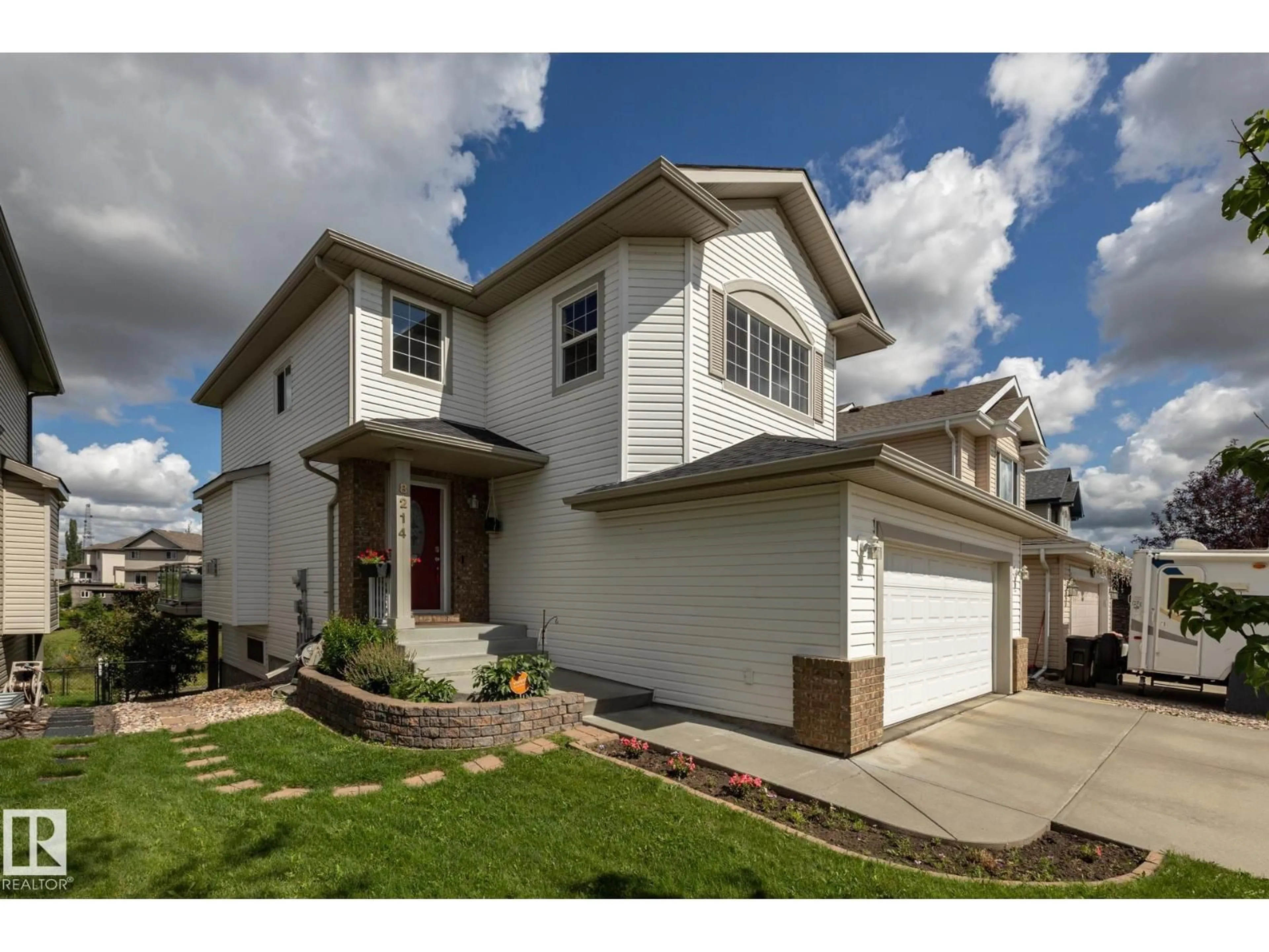 Home with vinyl exterior material, street for SW - 8214 6 AV, Edmonton Alberta T6X1L6