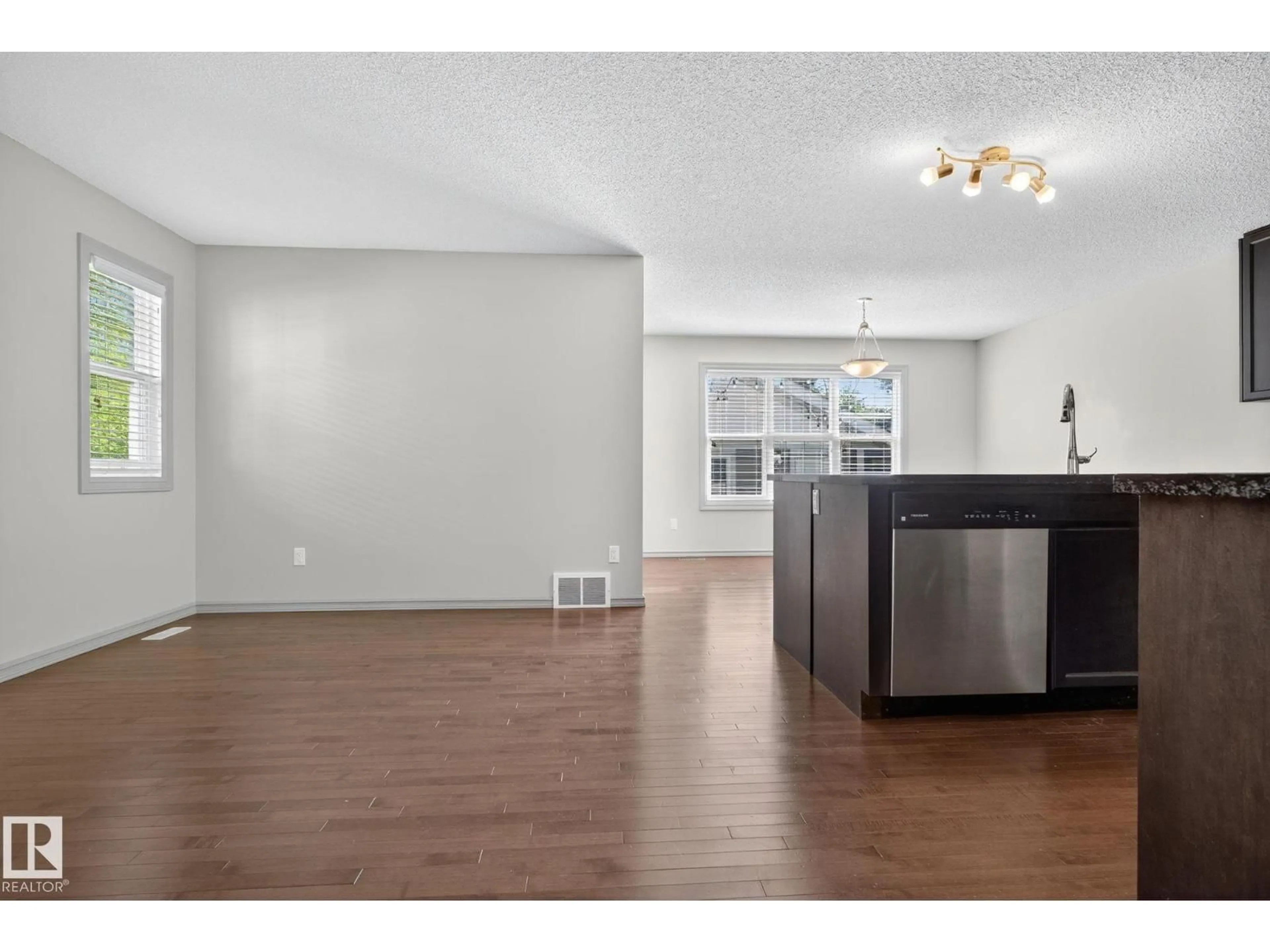 Open concept kitchen, wood/laminate floor for 955 VALOUR WY, Edmonton Alberta T5E6P2