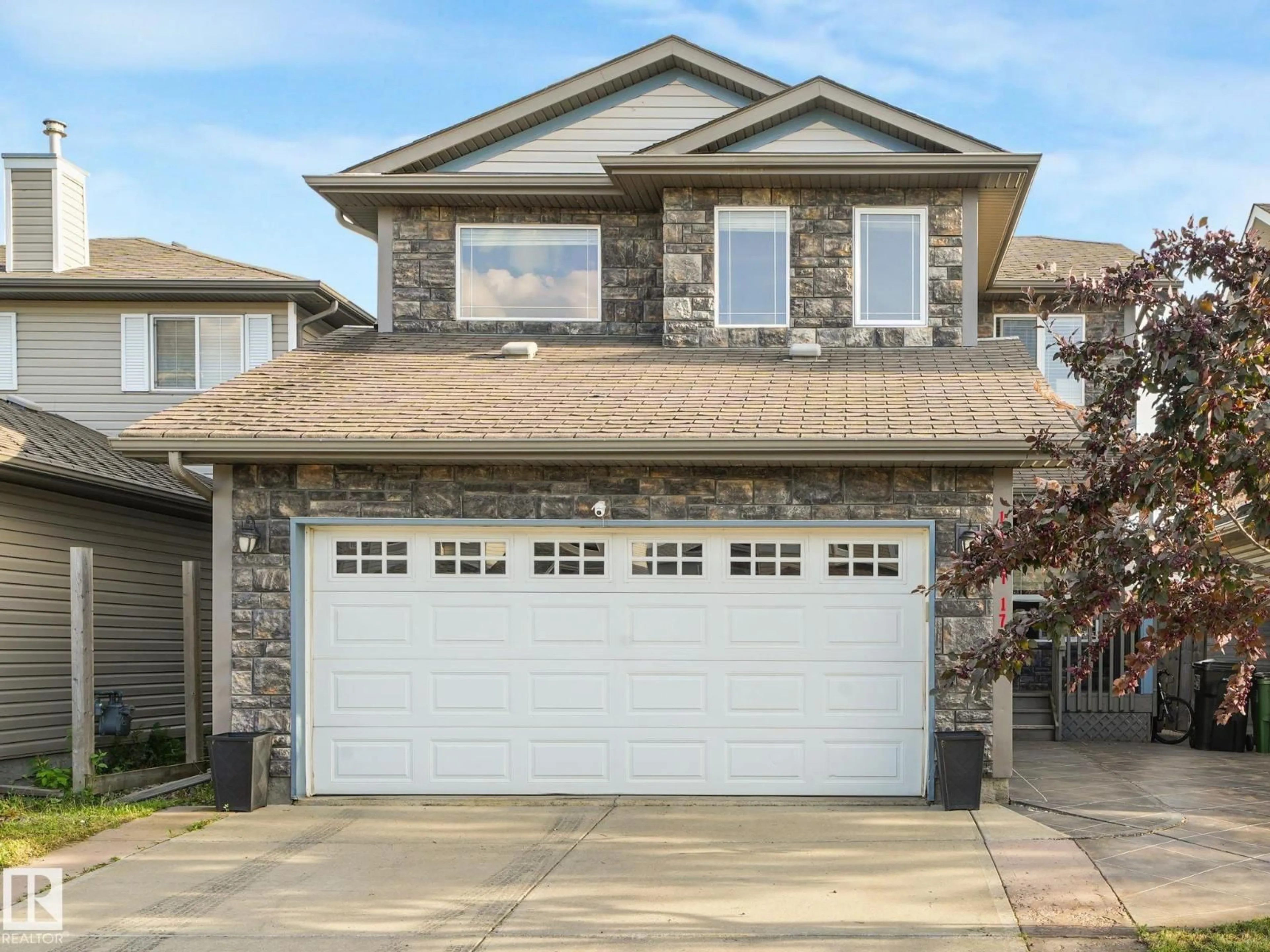 Home with vinyl exterior material, street for 11807 170 AV, Edmonton Alberta T5X6H8