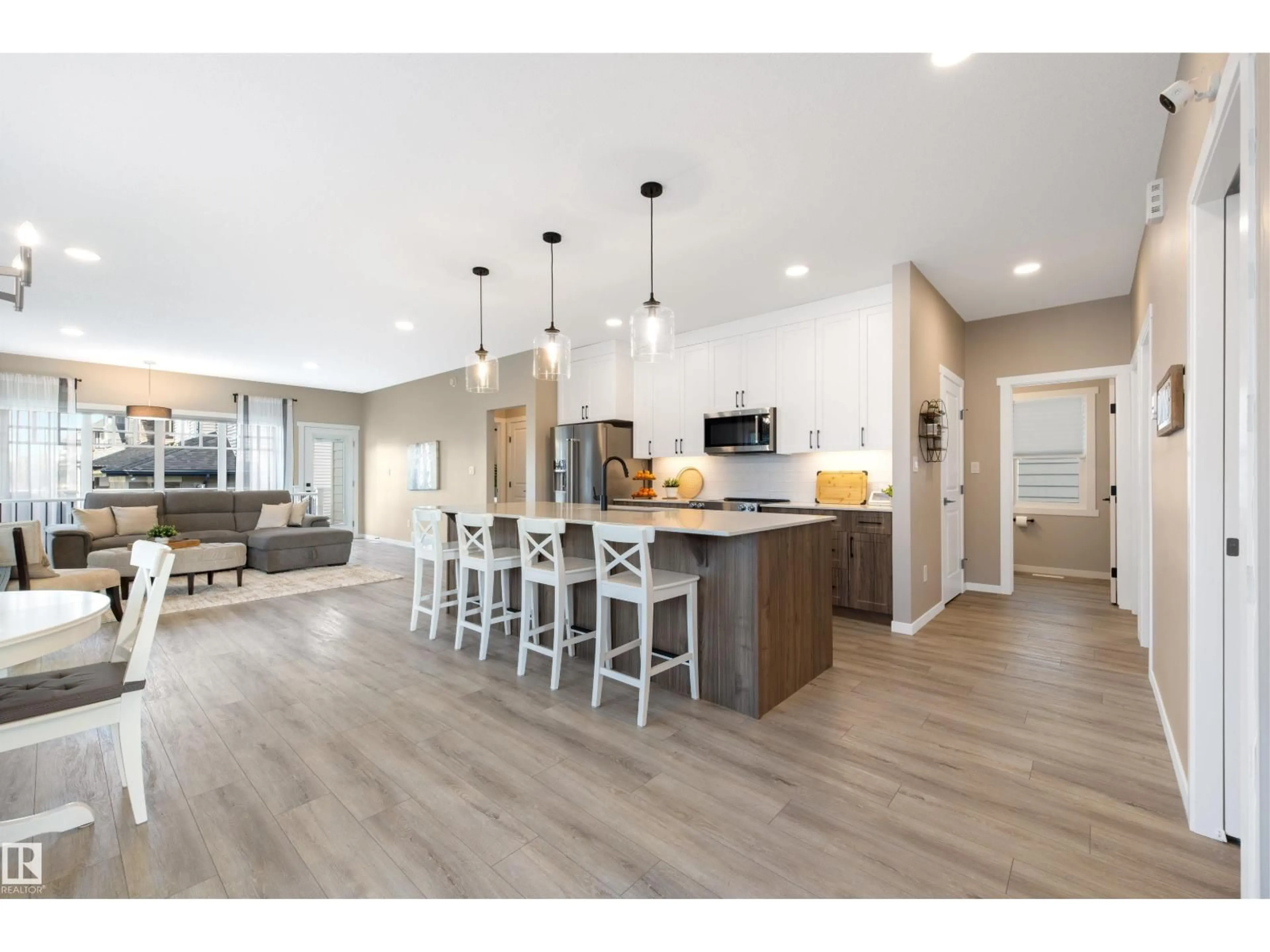 Open concept kitchen, wood/laminate floor for SW - 1804 AINSLIE CO, Edmonton Alberta T6W2R8