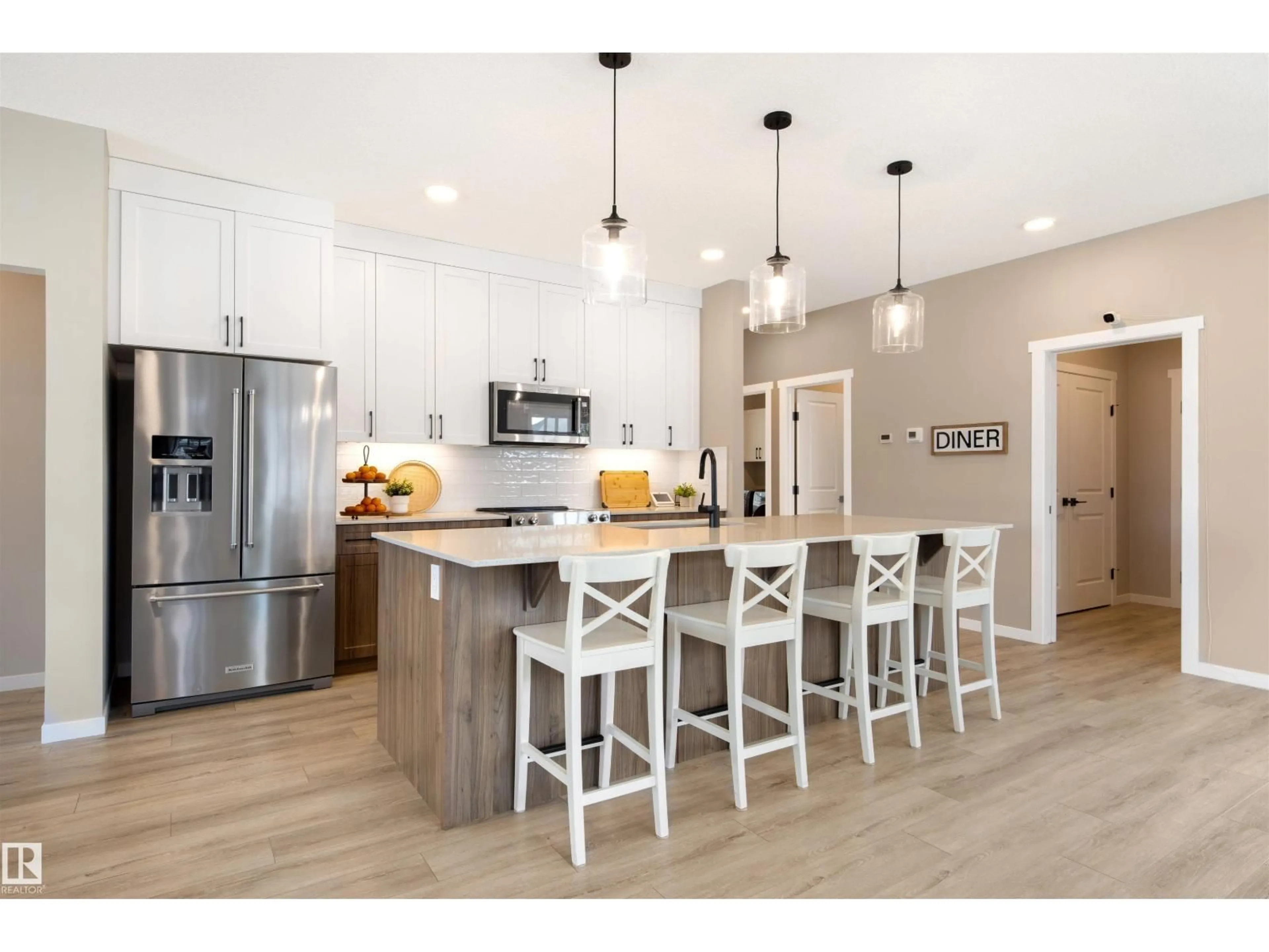 Open concept kitchen, wood/laminate floor for SW - 1804 AINSLIE CO, Edmonton Alberta T6W2R8