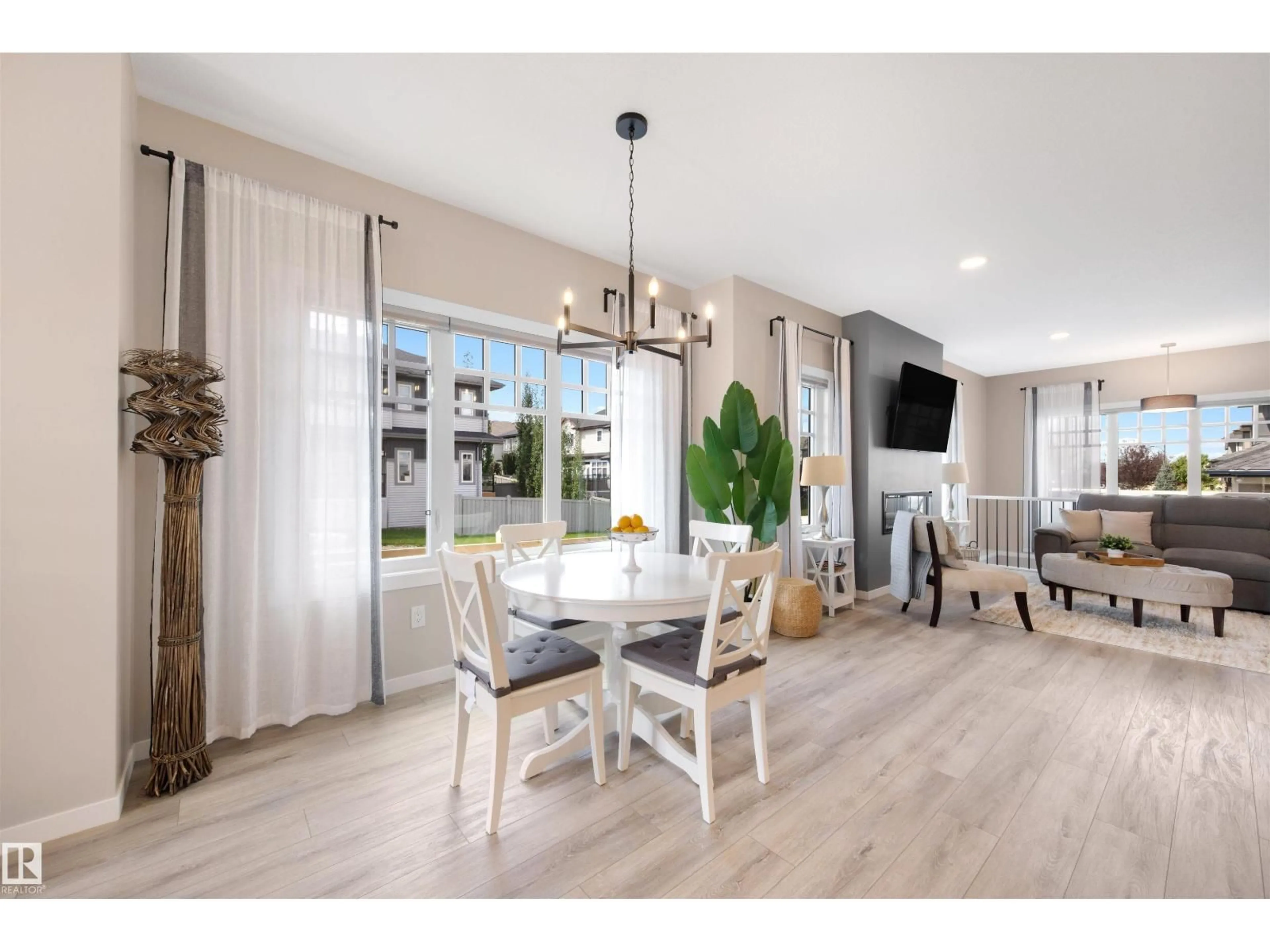 Open concept kitchen, wood/laminate floor for SW - 1804 AINSLIE CO, Edmonton Alberta T6W2R8