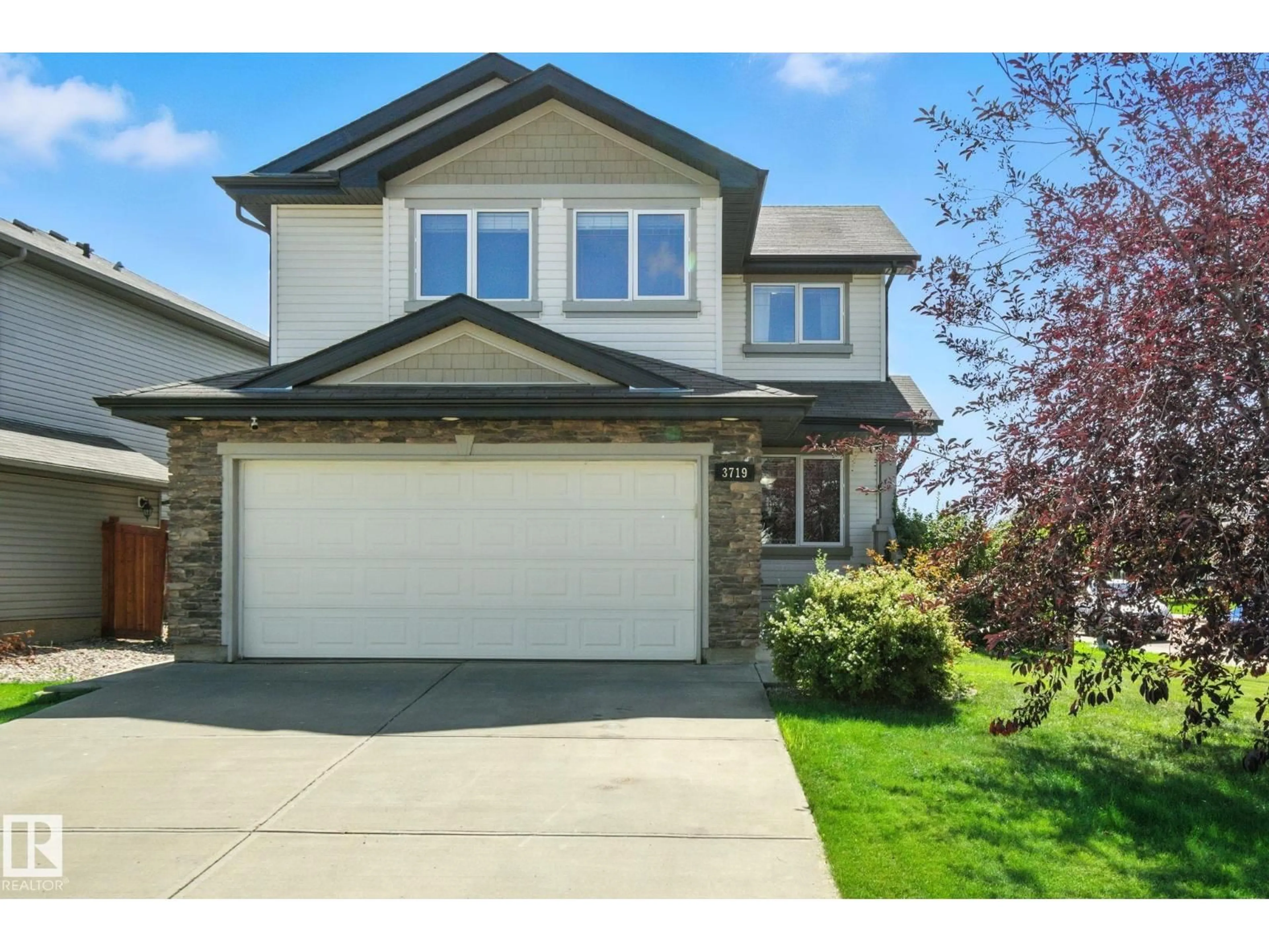 Home with vinyl exterior material, street for 3719 163 AV, Edmonton Alberta T5Y0H9