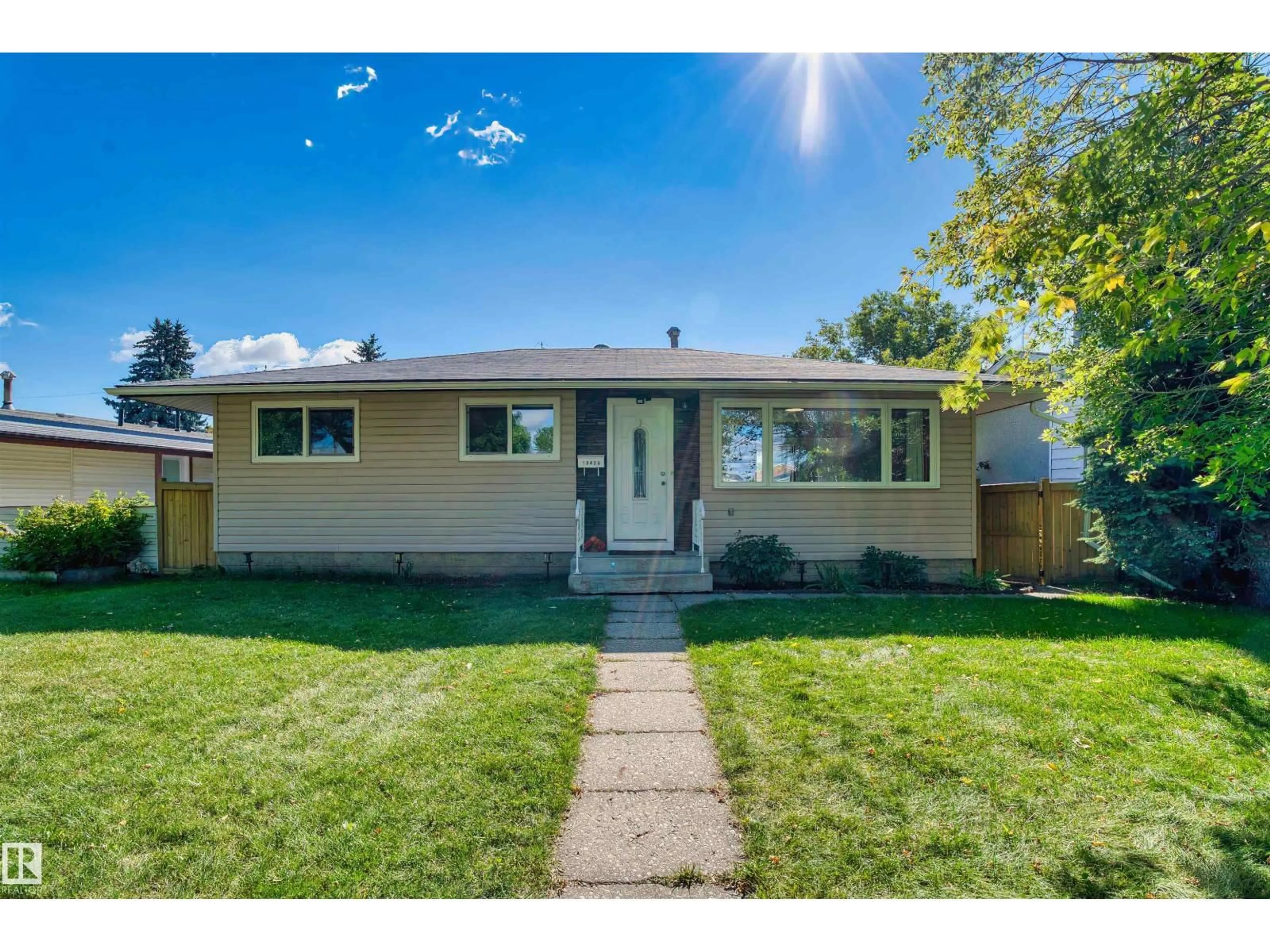 Home with vinyl exterior material, street for NW - 10425 166 ST, Edmonton Alberta T5P3V3