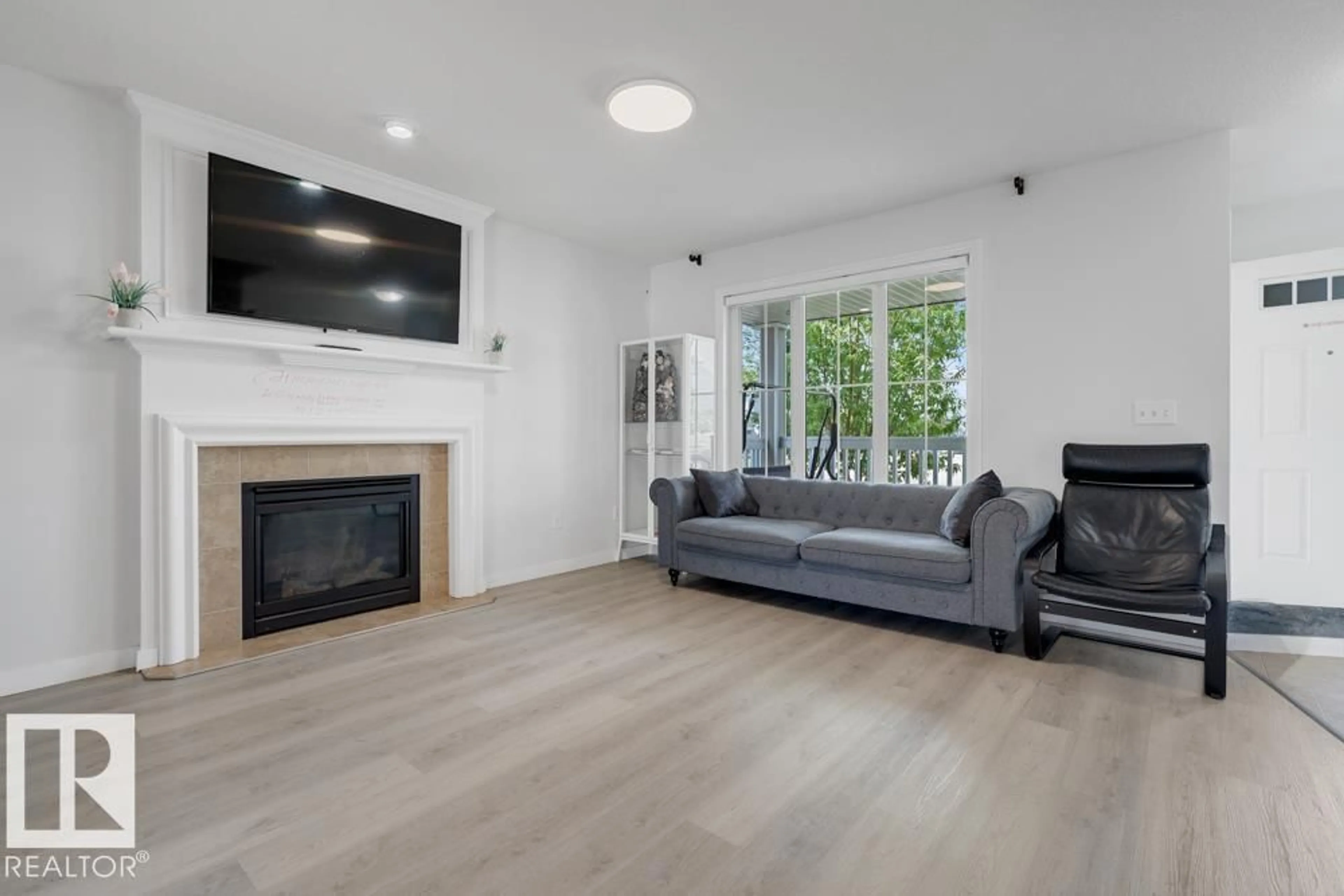 Living room with furniture, wood/laminate floor for 511 WATT BV, Edmonton Alberta T6X0V8