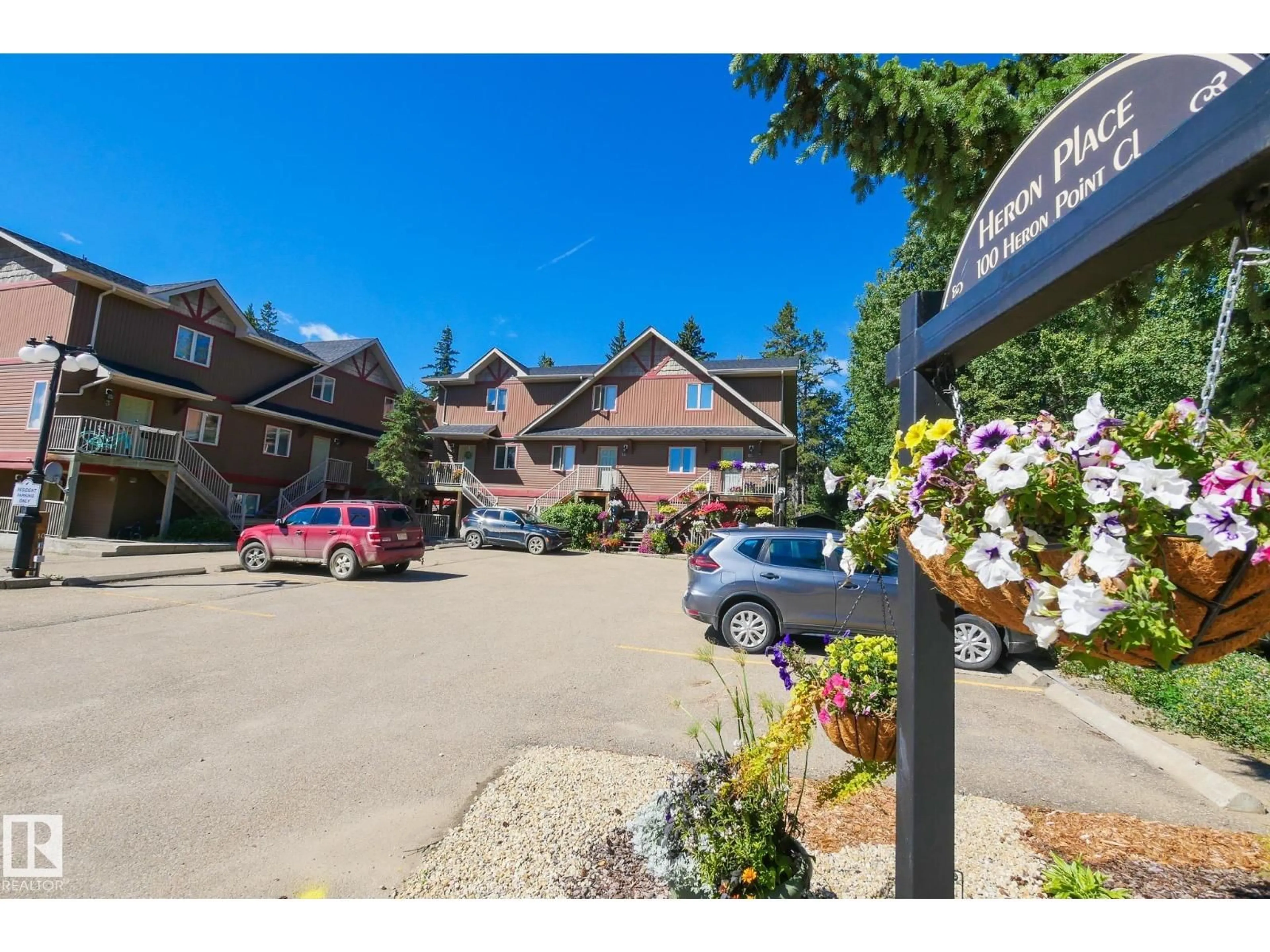 A pic from outside/outdoor area/front of a property/back of a property/a pic from drone, mountain view for 100 - 12 HERON POINT CL, Rural Wetaskiwin County Alberta T0C2V0