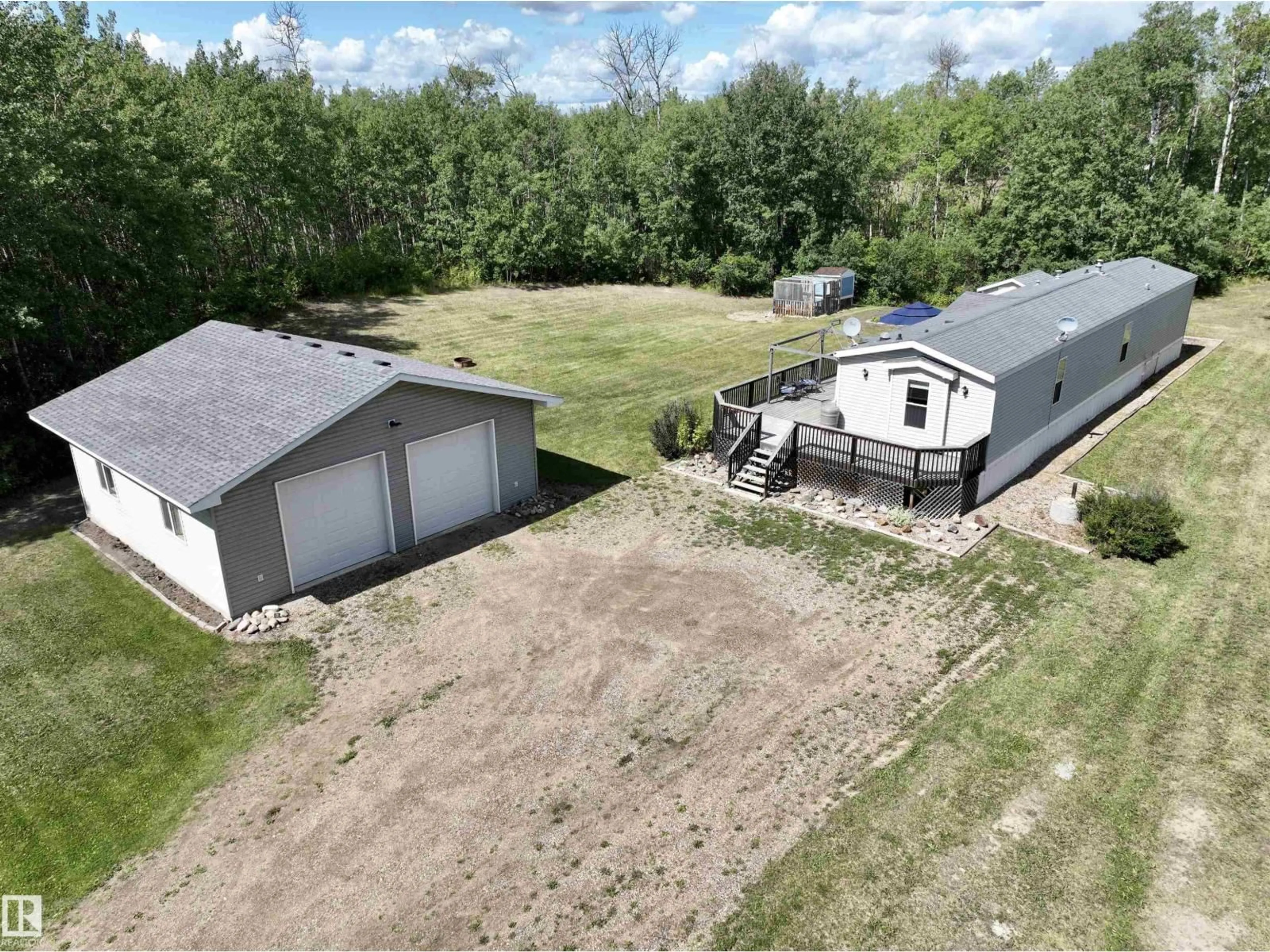 A pic from outside/outdoor area/front of a property/back of a property/a pic from drone, building for 113 - 111 58532 RR, Rural St. Paul County Alberta T0A0C0