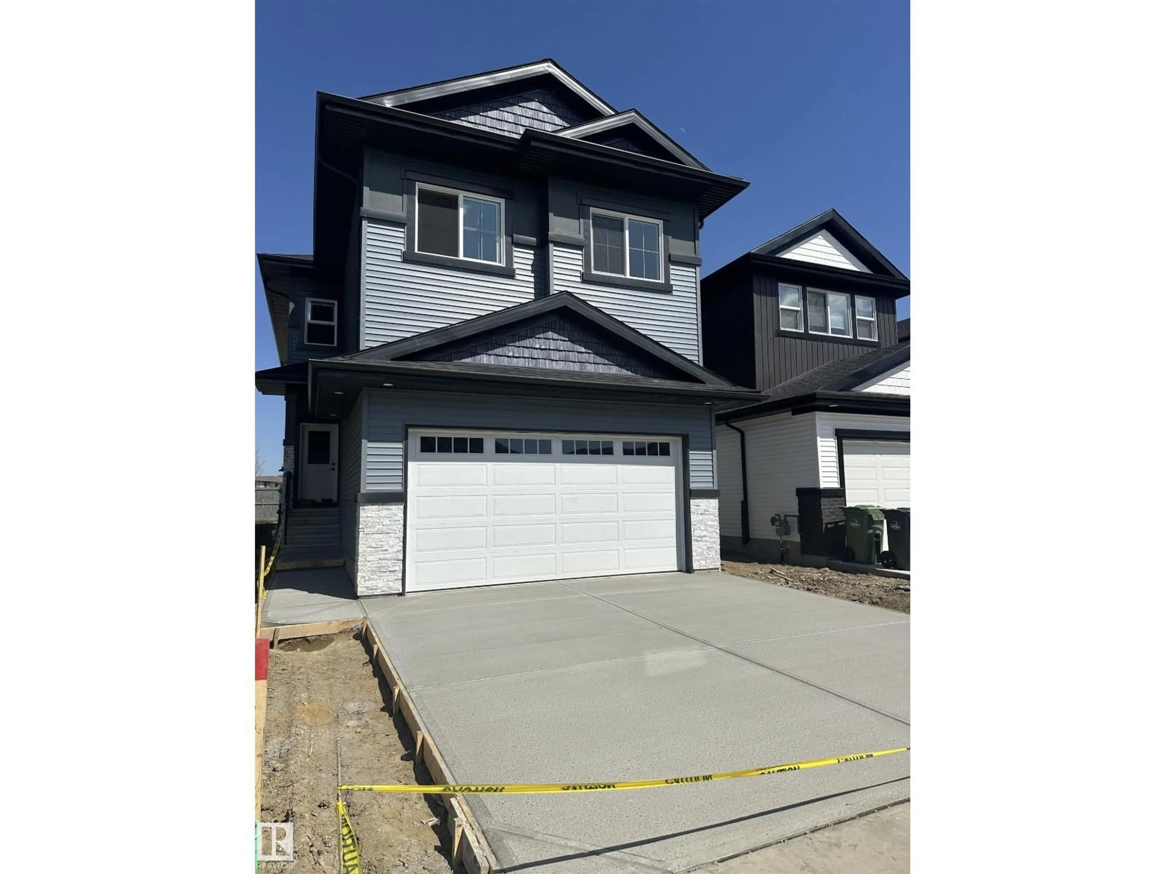 Home with vinyl exterior material, street for 205 KETTYL CO, Leduc Alberta T9E1S1