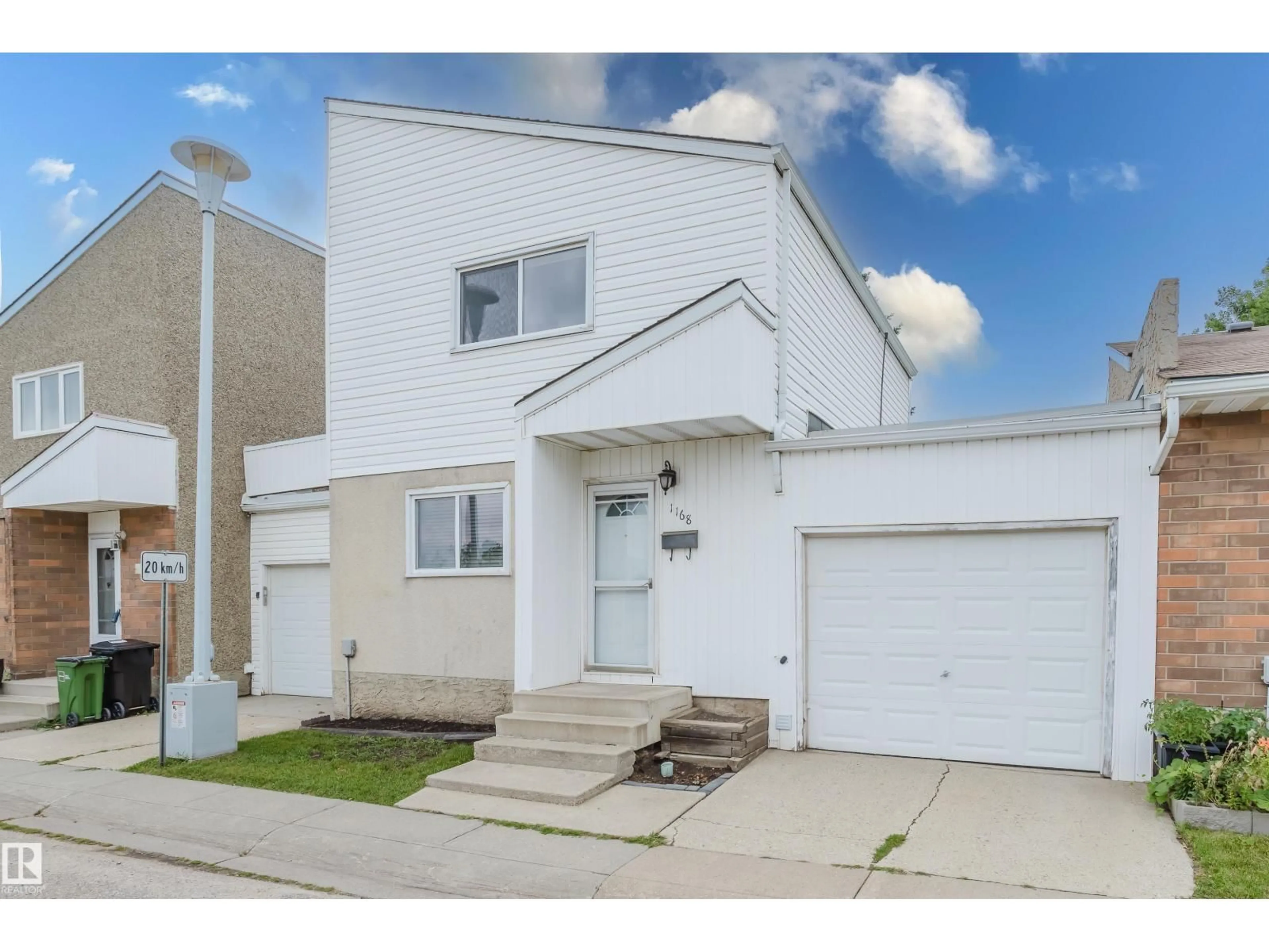 Home with vinyl exterior material, street for 1168 MILLBOURNE RD E NW, Edmonton Alberta T6K1W1
