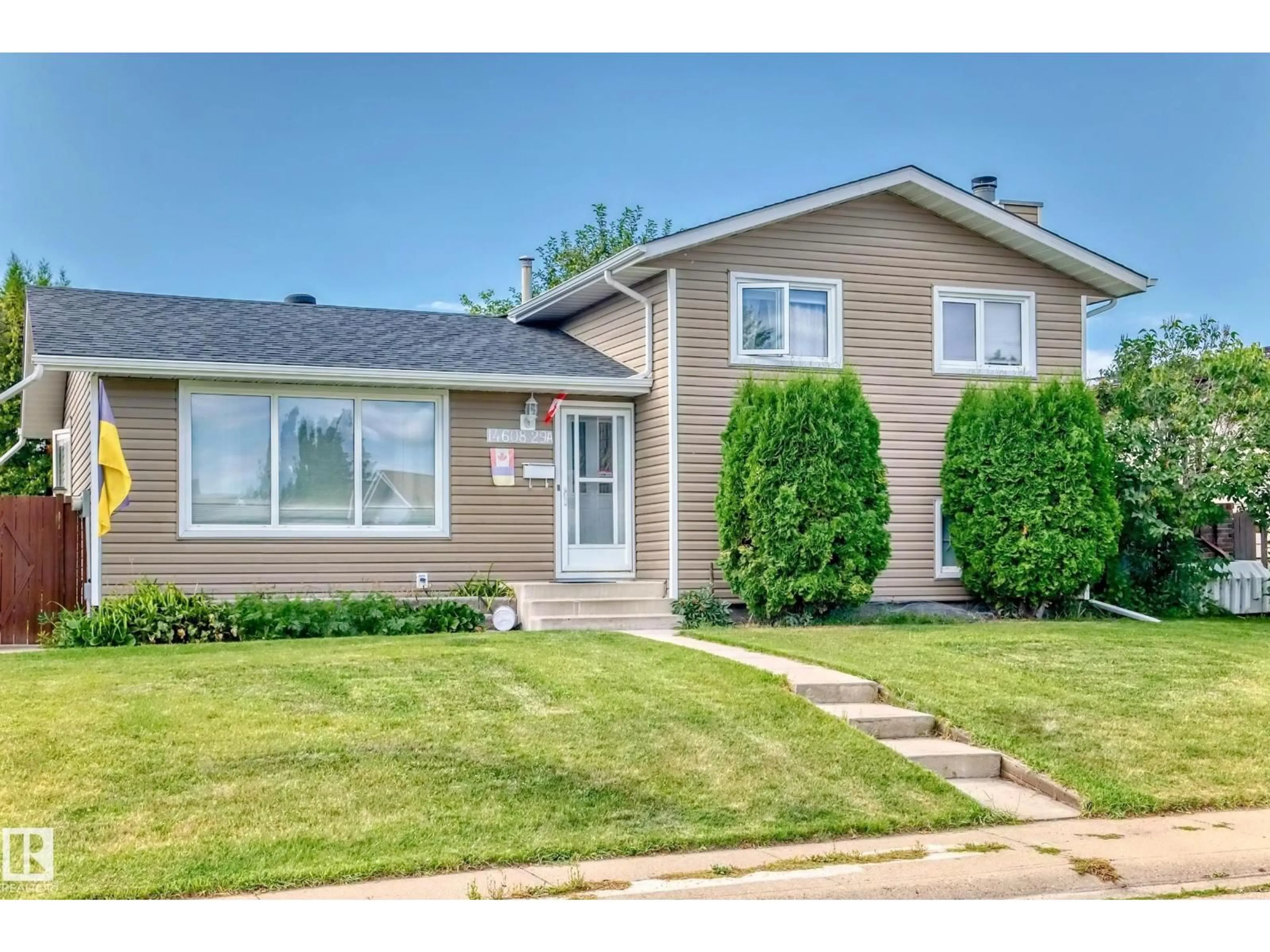 Home with vinyl exterior material, street for NW - 14608 29A ST, Edmonton Alberta T5Y2A2