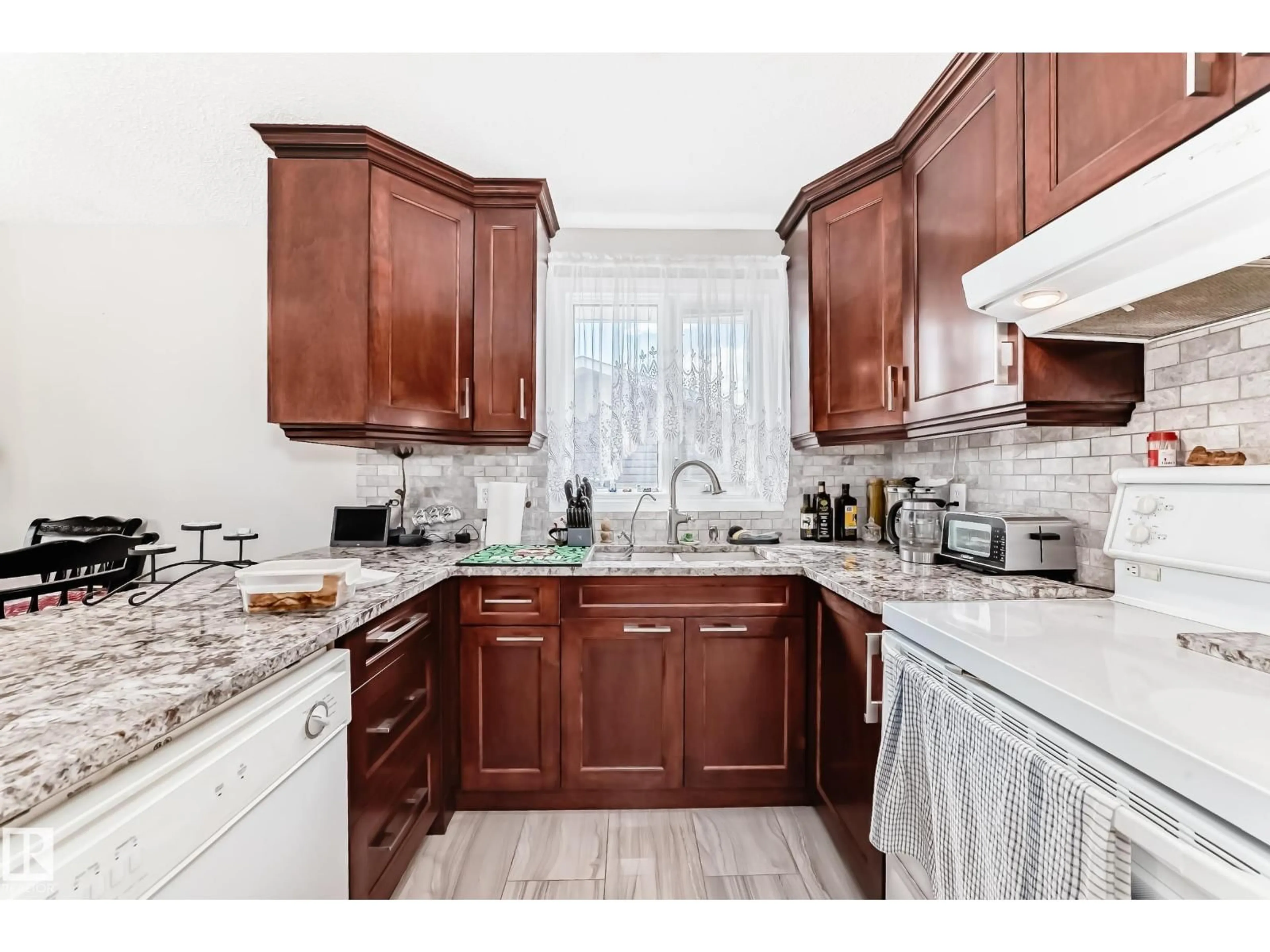 Open concept kitchen, ceramic/tile floor for NW - 14608 29A ST, Edmonton Alberta T5Y2A2