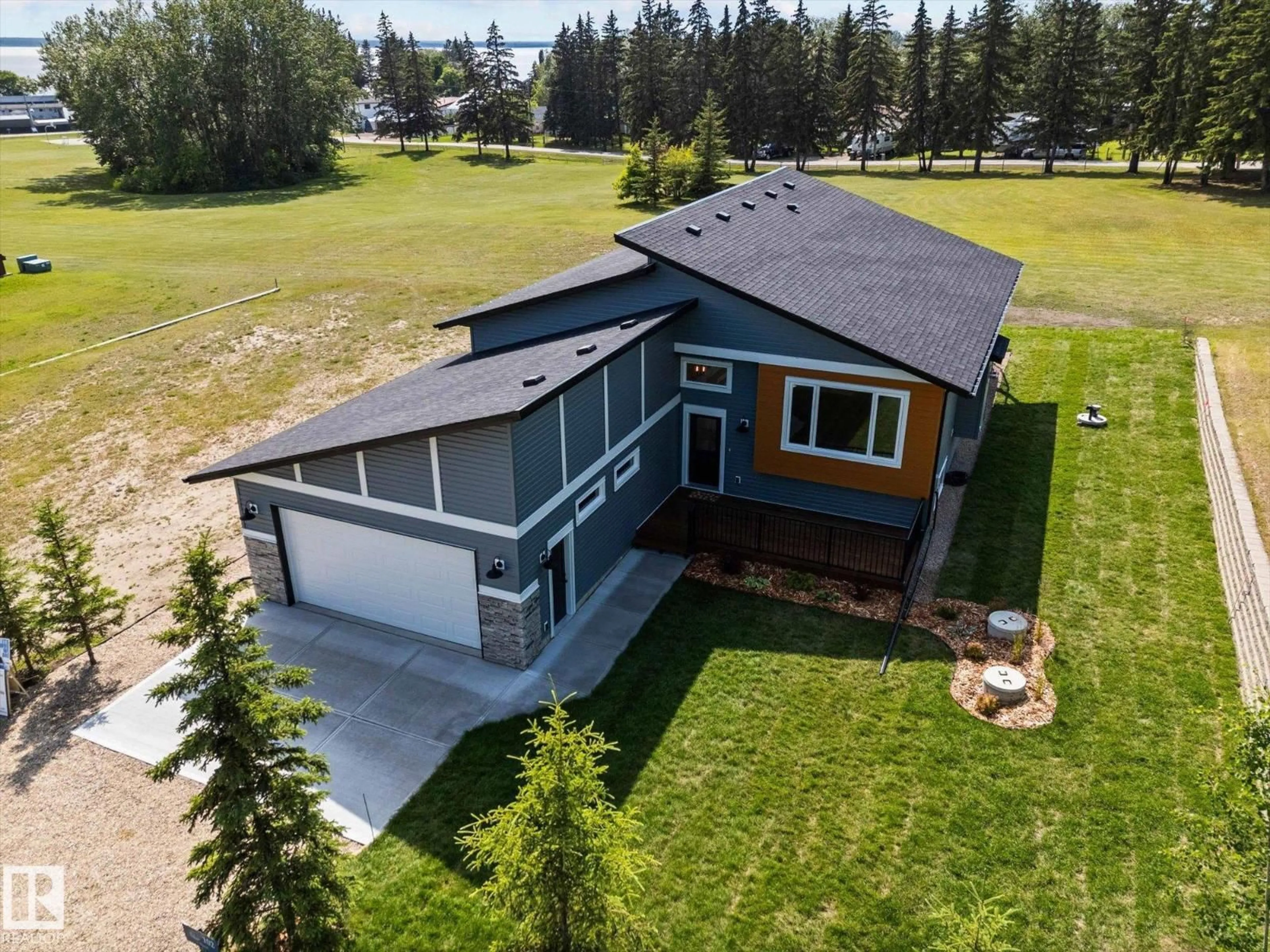 A pic from outside/outdoor area/front of a property/back of a property/a pic from drone, water/lake/river/ocean view for 102 1 STREET, Rural Lac Ste. Anne County Alberta T0E0A0