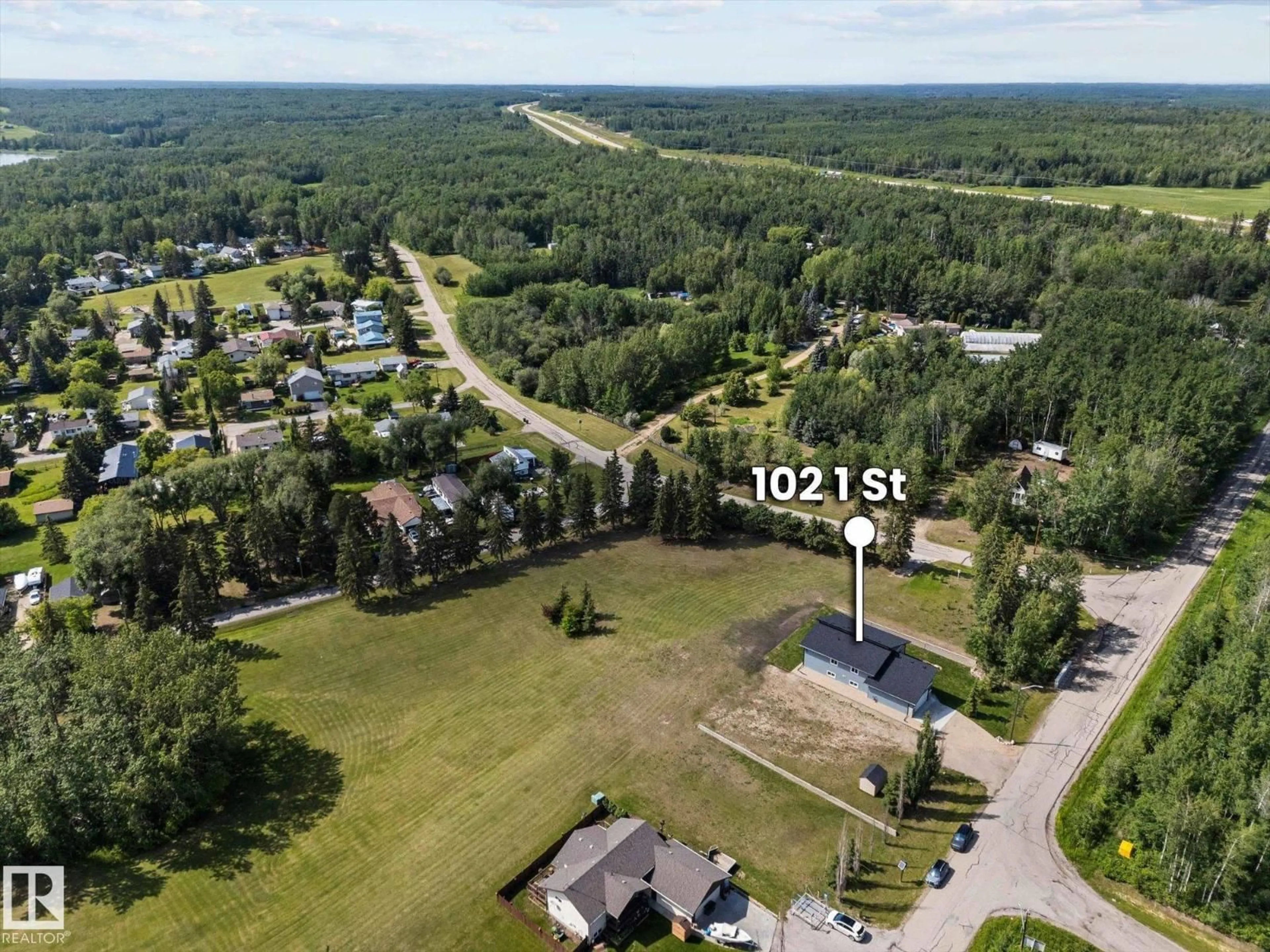A pic from outside/outdoor area/front of a property/back of a property/a pic from drone, forest/trees view for 102 1 STREET, Rural Lac Ste. Anne County Alberta T0E0A0