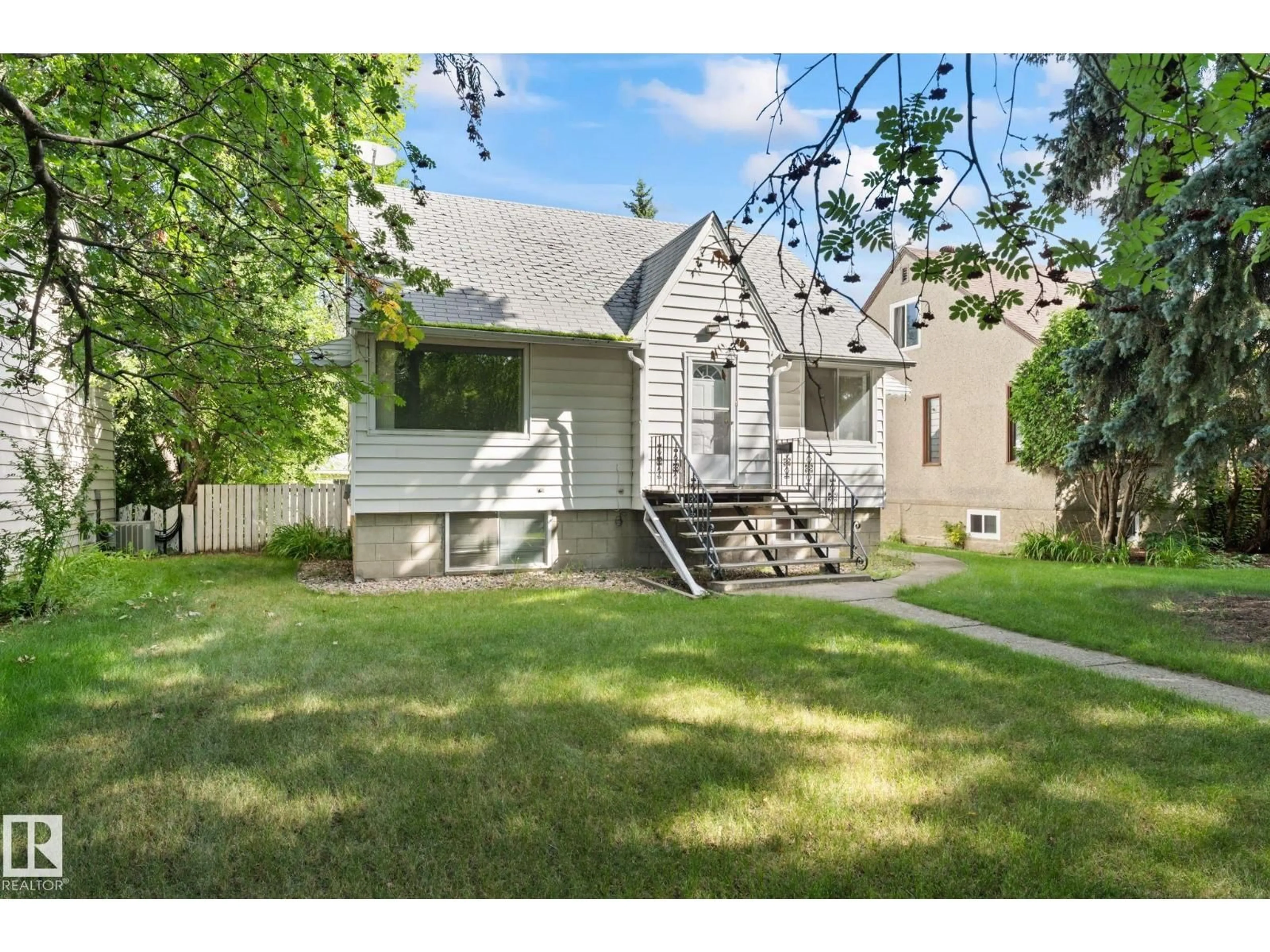 Home with vinyl exterior material, street for 11234 71 AV, Edmonton Alberta T6G0A6