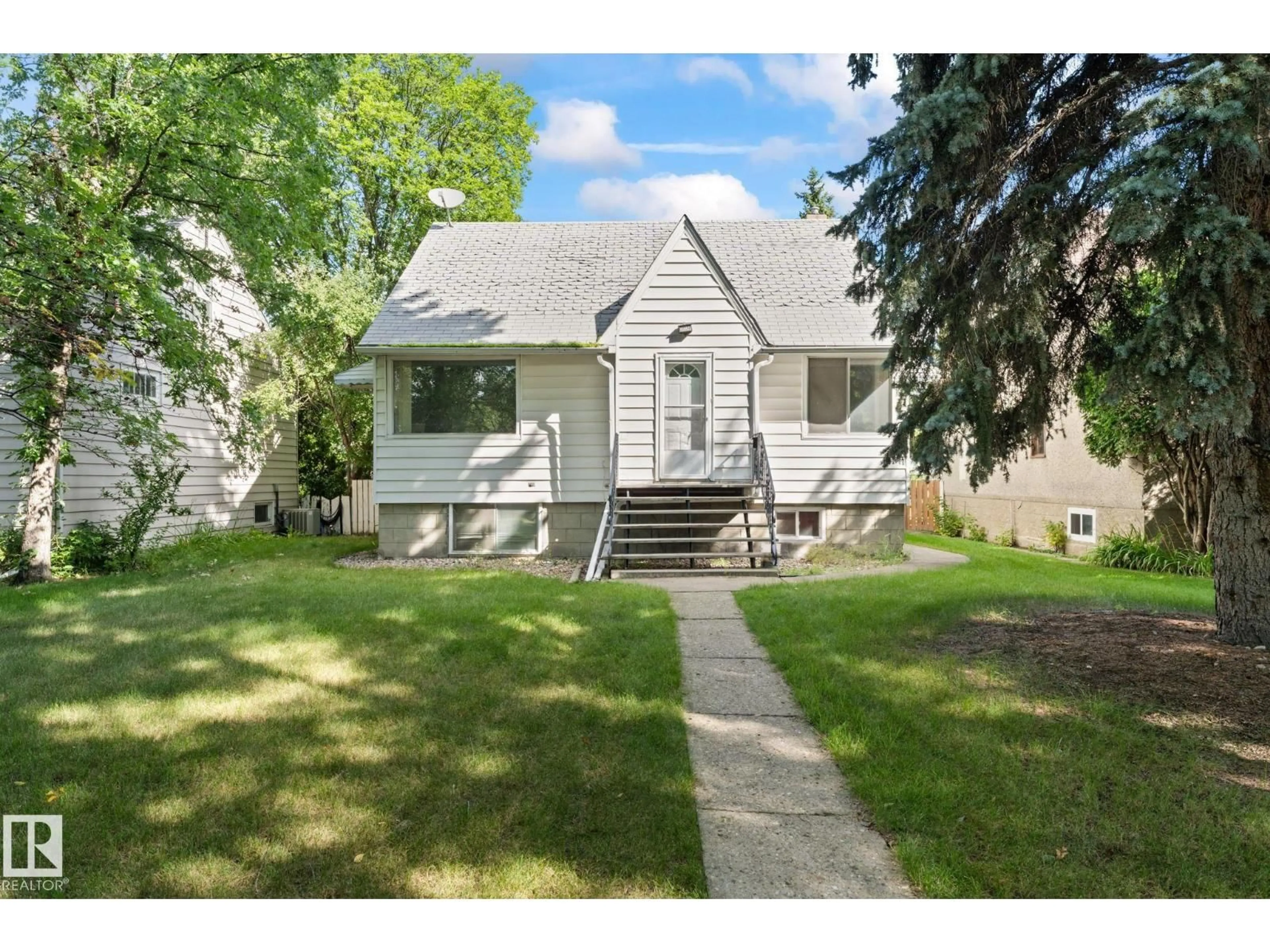 Home with vinyl exterior material, street for 11234 71 AV, Edmonton Alberta T6G0A6