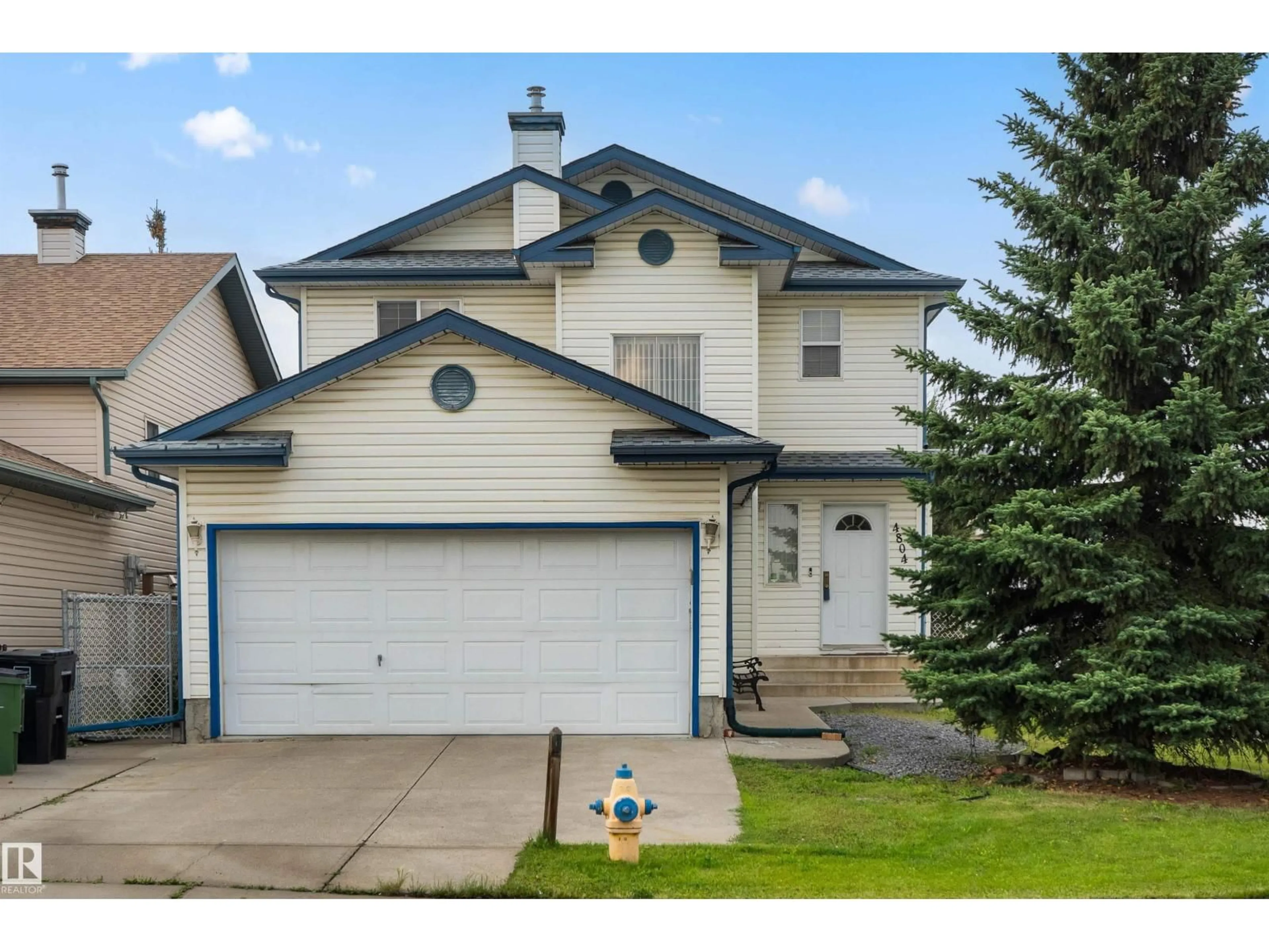 Home with vinyl exterior material, street for 4804 147 AV, Edmonton Alberta T5Y2X2