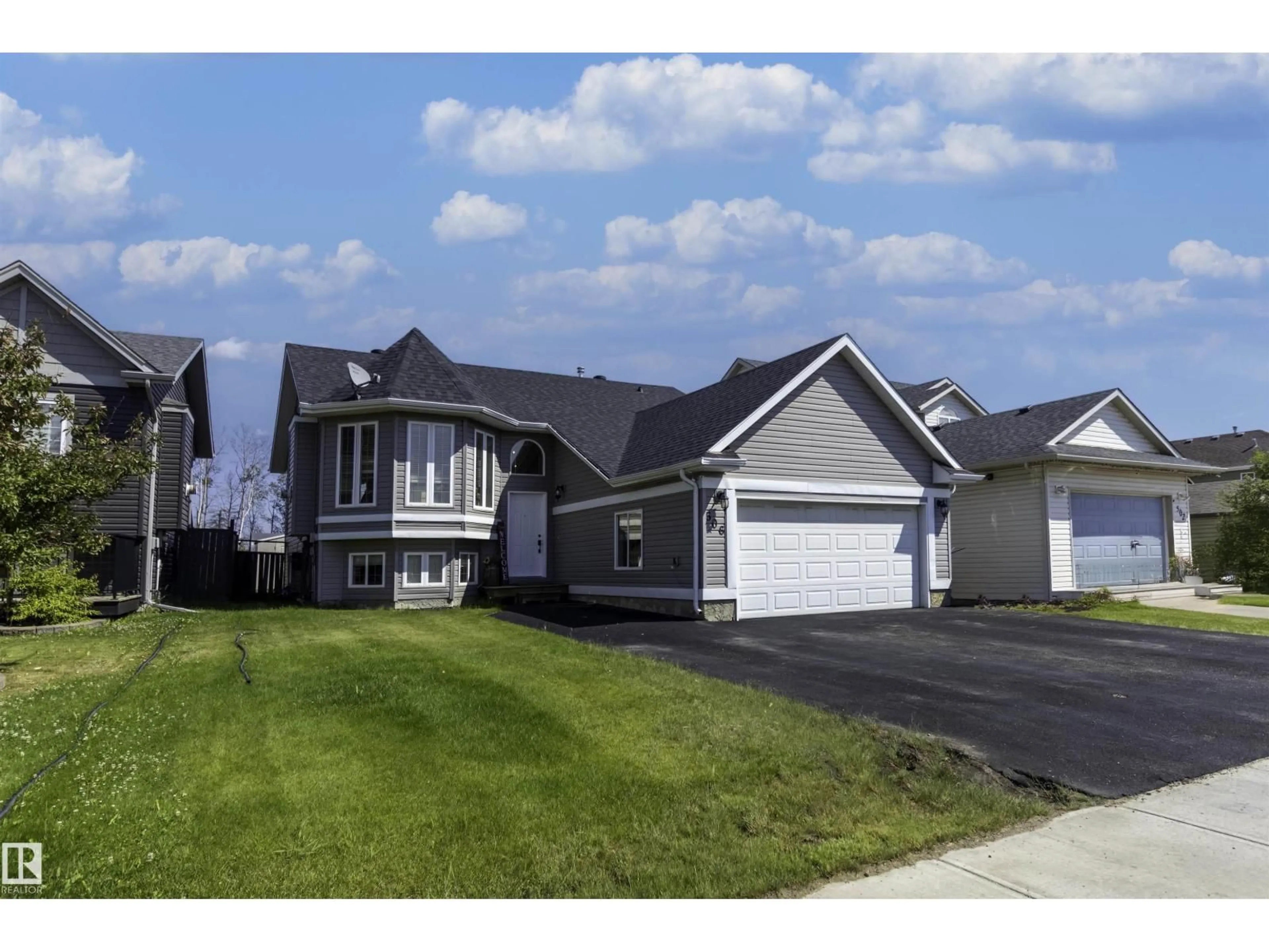 Home with vinyl exterior material, street for 506 ATHABASCA AV, Fort McMurray Alberta T9J1G8