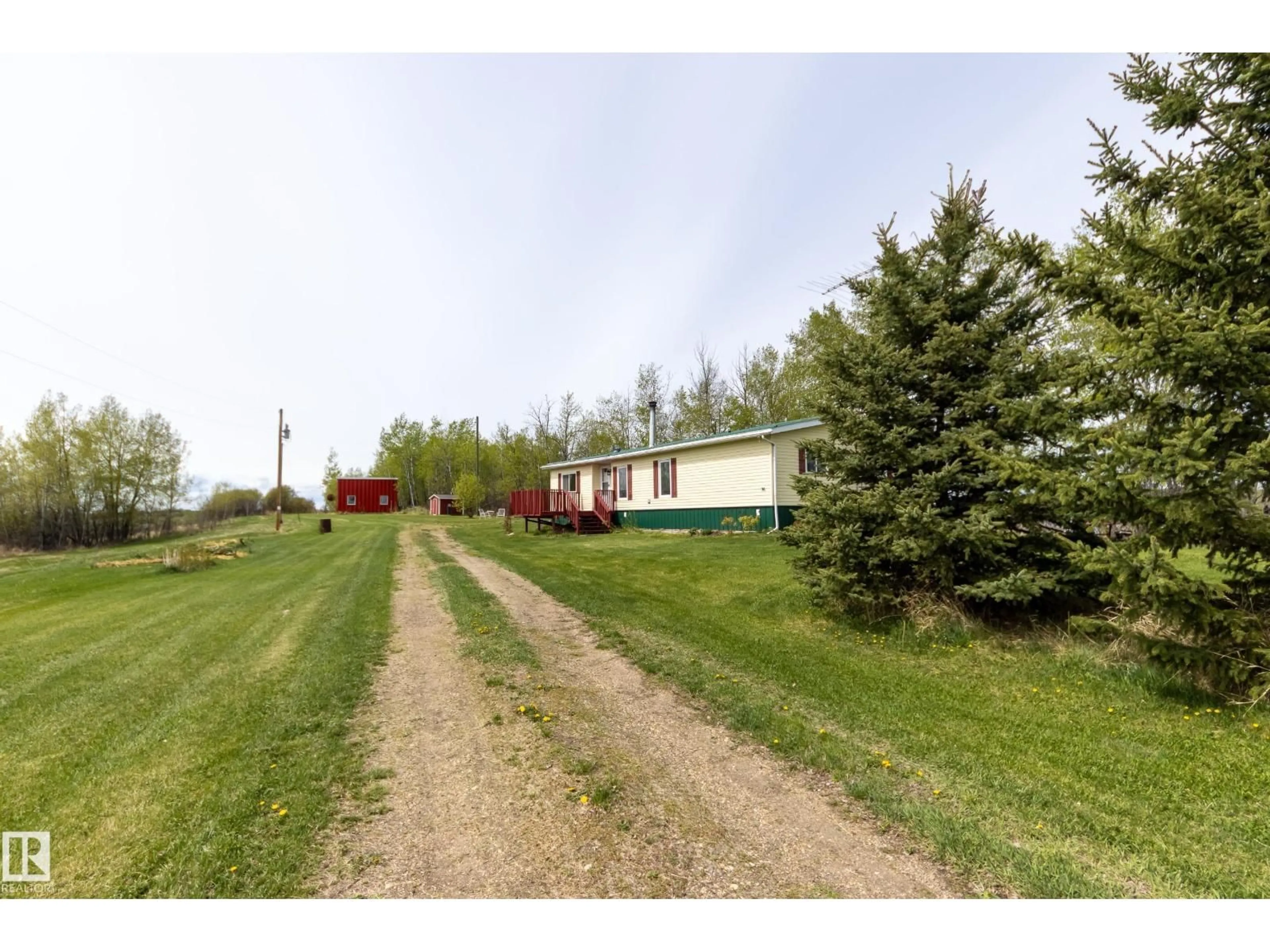 A pic from outside/outdoor area/front of a property/back of a property/a pic from drone, unknown for 55418 RANGE ROAD 70, Rural Lac Ste. Anne County Alberta T0W2A0