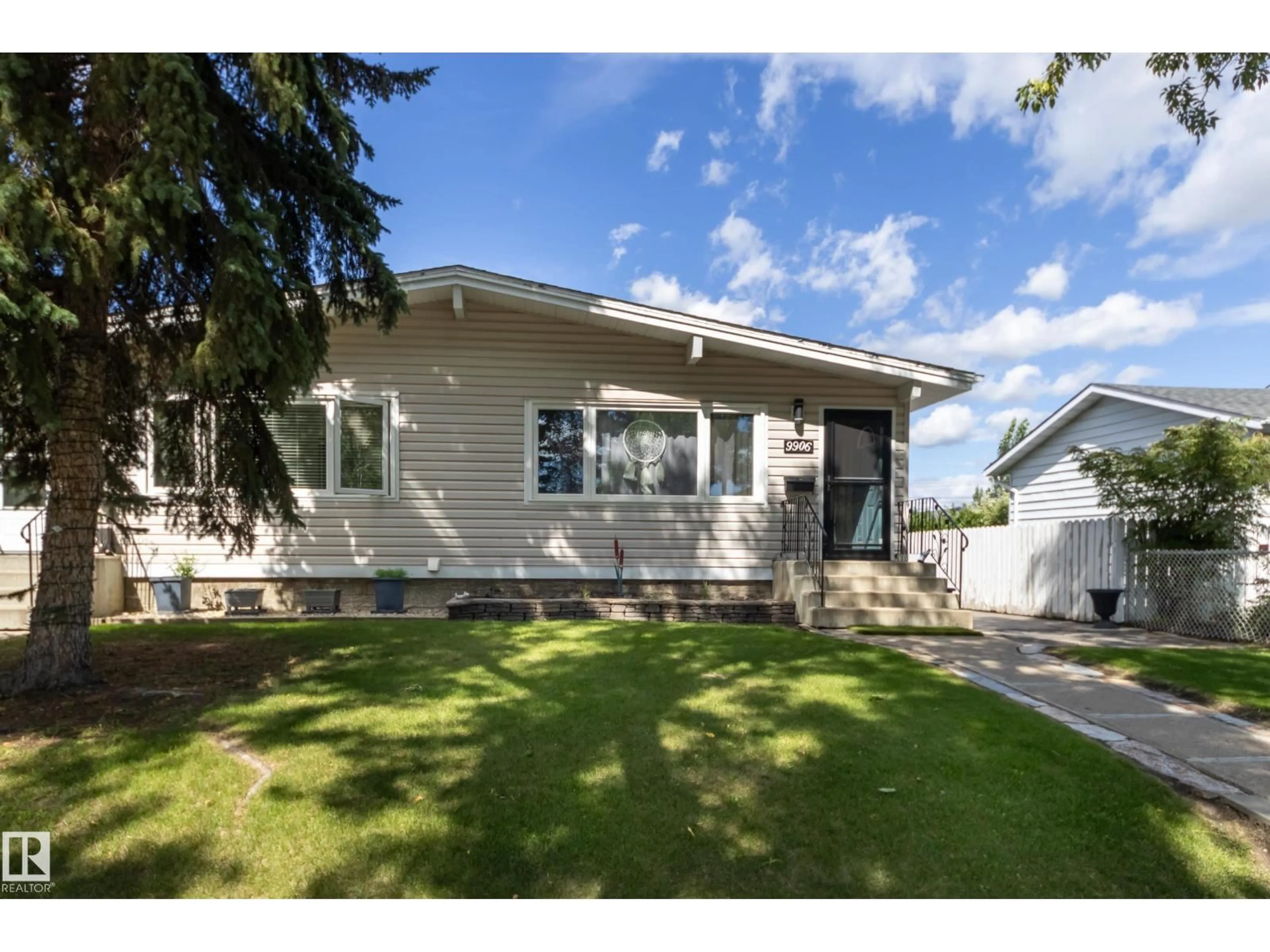 Home with vinyl exterior material, street for 9906 96A AV, Fort Saskatchewan Alberta T8L1P6
